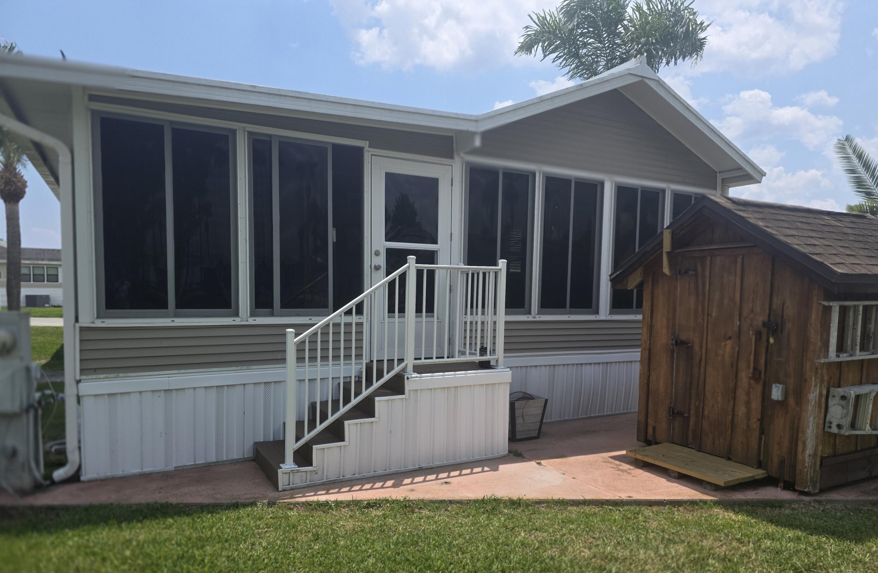 Move In Ready lovely doublewide located in Ancient Oaks on a large lake front lot with lovely trees