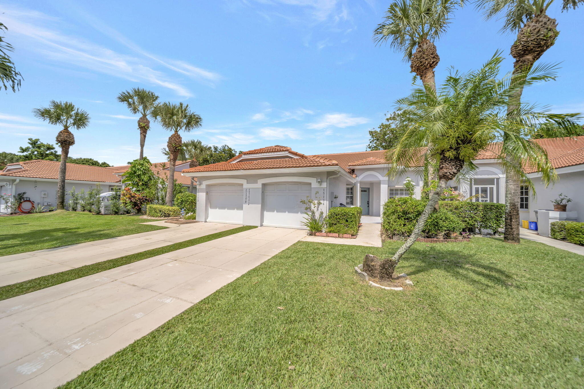 Welcome to this beautifully renovated 2 bedroom, 2 bath villa offering peaceful lake views and effortless Florida living. A freshly painted, inviting front courtyard welcomes you home, while the attached one car garage with interior access adds everyday convenience.  Inside, you'll find soaring vaulted ceilings, oversized baseboards, ceiling fans throughout, recently painted interior walls, new laminate flooring and tile, and a bright, open layout. The fully renovated eat-in kitchen features new stainless steel appliances, including a refrigerator, microwave, range and dishwasher, pantry and an upgraded deep workstation sink with multiple rinse components and a built-in soap dispenser. Both bathrooms have also been beautifully fully renovated, creating a truly move ready home. Additional upgrades include a newer roof 2022, a water heater that's approximately one year old, a whole house EcoWater Angel water filtration system installed just two years ago, a full size stackable washer and dryer, attic storage, an additional refrigerator in the garage and accordion hurricane shutters on all openings for added storm protection and peace of mind.  The primary suite is a relaxing retreat featuring a deep walk in closet, multiple windows showcasing tranquil lake views, and direct access to the covered, screened patio. The living room also opens to the patio, creating the perfect space for indoor/outdoor living, entertaining, or simply enjoying the serene waterfront setting.  Residents enjoy access to fantastic community amenities, including a clubhouse, pool, tennis/pickleball courts and a dog park. Ideally located in Delray Beach, this home is just minutes from the Florida Turnpike, making commuting a breeze. Enjoy nearby shopping centers, restaurants, grocery stores and everyday conveniences, while vibrant Atlantic Avenue in Downtown Delray Beach offers award winning dining, boutique shopping, art galleries, entertainment, and beautiful beaches just a short drive away. This home combines modern updates, comfort, convenience and the very best of the SFL lifestyle.