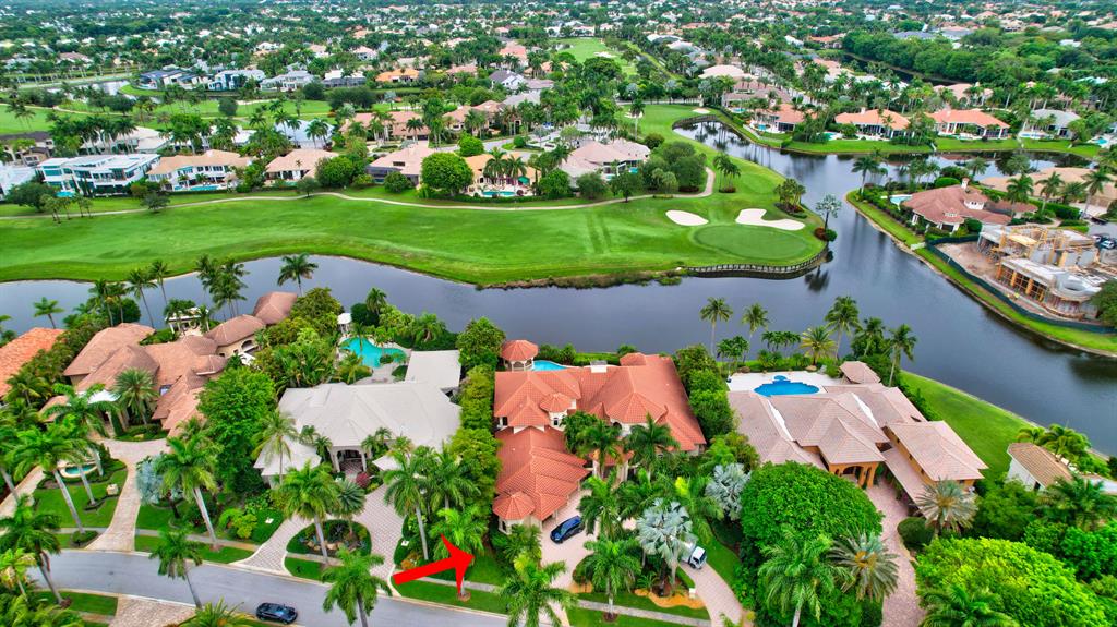 One of the BEST WATER & GOLF VIEWS in St. Andrews CC! Located on an OVERSIZED LOT (0.59 acres) in the desirable Lake Estates section. This elegant 2-story home with 5-bedrooms, office, and den, has it all! The impressive entryway opens to a light, bright and open interior, with 30' volume ceilings and floor-to-ceiling windows. Large ground-level master suite with his & her baths, custom walk-in closets, and separate sitting area. Downstairs are the master suite, 2 guest bedrooms, office, and a den. Upstairs are 2 guest bedrooms, spacious loft, and covered balcony. All guest bedrooms are en suite. The backyard has open, covered, and screened-in patio areas, gazebo with built-in BBQ, pool w/spa, and expansive lake & golf course views.