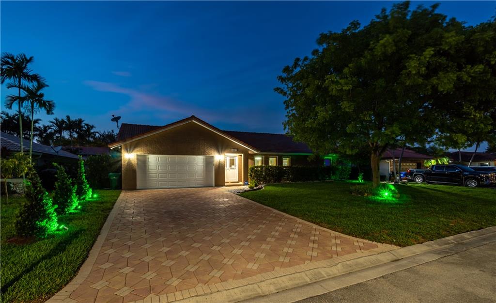 Welcome Home! THIS IS A MUST SEE!!!  Your new, fabulous remodeled home features impact windows and doors. Neutral pallet with a little bling!  New, remodeled, spa-like master bathroom, remodeled guest bath, white kitchen with granite counters, remodeled powder room, laundry room, split floor plan, family room with bar, living room, dining room with spectacular view of your in ground swimming pool that offers automation multi-color lighting. . Newly remodeled pool deck with white marble, covered patio, security cameras, privacy fence and turf!  Yes, turf!  no grass to mow in the back, easy to maintain and usable area for playing outdoor games, lounging or hosting.  Owner installed mini-split AC unit and beautiful tile in garage, perfect for office or home gym. Automated sprinkler system.