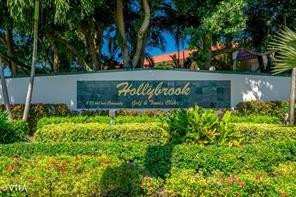 Discover comfort and convenience in this well-maintained 2-bedroom, 2-bath condo located in Phase 1 of the desirable Hollybrook Golf & Tennis Club, just a short walk to Pool #1. This partially furnished, move-in-ready unit offers a warm and inviting space to enjoy immediately or personalize to your taste. This unit features impact-resistant hurricane windows throughout, providing added peace of mind and energy efficiency. A transferable total appliance service agreement is included, adding exceptional value for the new owner. Located in a highly sought-after 55+ active community, residents enjoy free golf, tennis courts, multiple pools, a restaurant, fitness center, and an array of resort-style amenities. Bring all offers!