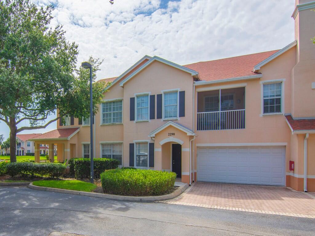 Enjoy a coastal feel in this light and bright condo with abundant windows, cathedral ceilings, and tranquil lake views, screened balcony. Features include a rare 2-car garage, crown moldings, wood-look plank flooring, stainless steel appliances, in-unit laundry room, and updated bath vanities. No age restrictions and pets are permitted. Community amenities include a resort-style pool, fitness center, and playground. Walk to shopping and restaurants, and enjoy being just minutes from the beach.
