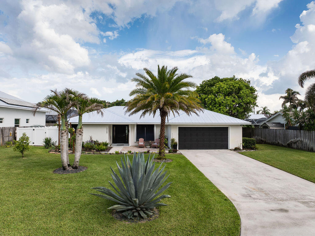 Beautifully renovated 3-bedroom, 2-bath home POOL home with a 2-car garage; move-in ready and designed for comfortable everyday living and effortless entertaining. Inside, you'll find LPV flooring throughout, an open-concept kitchen with modern finishes and newer appliances, updated bathrooms, a custom-designed closet and a bonus room with mini-split. The spacious floor plan flows seamlessly to the outdoor living area, where the covered patio and screened pool create the perfect private retreat. A versatile bonus room off the primary suite and pool area offers endless possibilities. Fully fenced, low maintenance yard with papaya and avocado trees. 2025 metal roof and partial impact glass windows. Well with water filtration system and city sewer. 2024 A/C. Located in desirable Rocky Point, one of Stuart's most sought-after waterfront communities where coastal charm, ocean breezes, and a laid-back Florida lifestyle come together. You'll enjoy refreshing ocean breezes, easy access to boating, fishing, parks, and some of the area's favorite waterfront restaurants. Best of all, there is no HOA, giving you the freedom to enjoy your property without additional restrictions or fees.