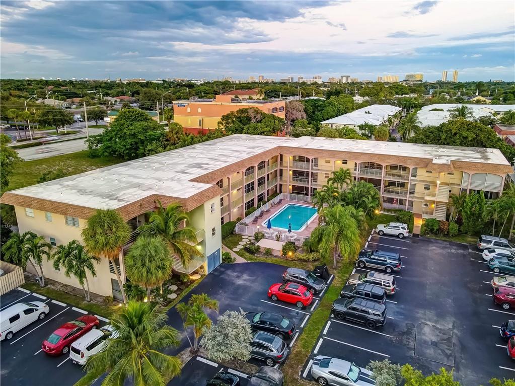 HUGE 2 bed, 2 bath corner unit with lanai open to park like setting.  Updated kitchen and baths with new tile floor throughout.  Roof replaced in 2015, A/C 2 years old. Hurricane windows.  Heated pool in delightful courtyard with BBQ grill.  Laundry room across hallway with extra storage room. Only 5 minutes to the beach. Close to shopping, entertainment, restaurants, casinos, golf.  50 years left on the land lease. All ages, Cash only.  Must own for one year before renting, then only annual rentals allowed. NO Airbnb.