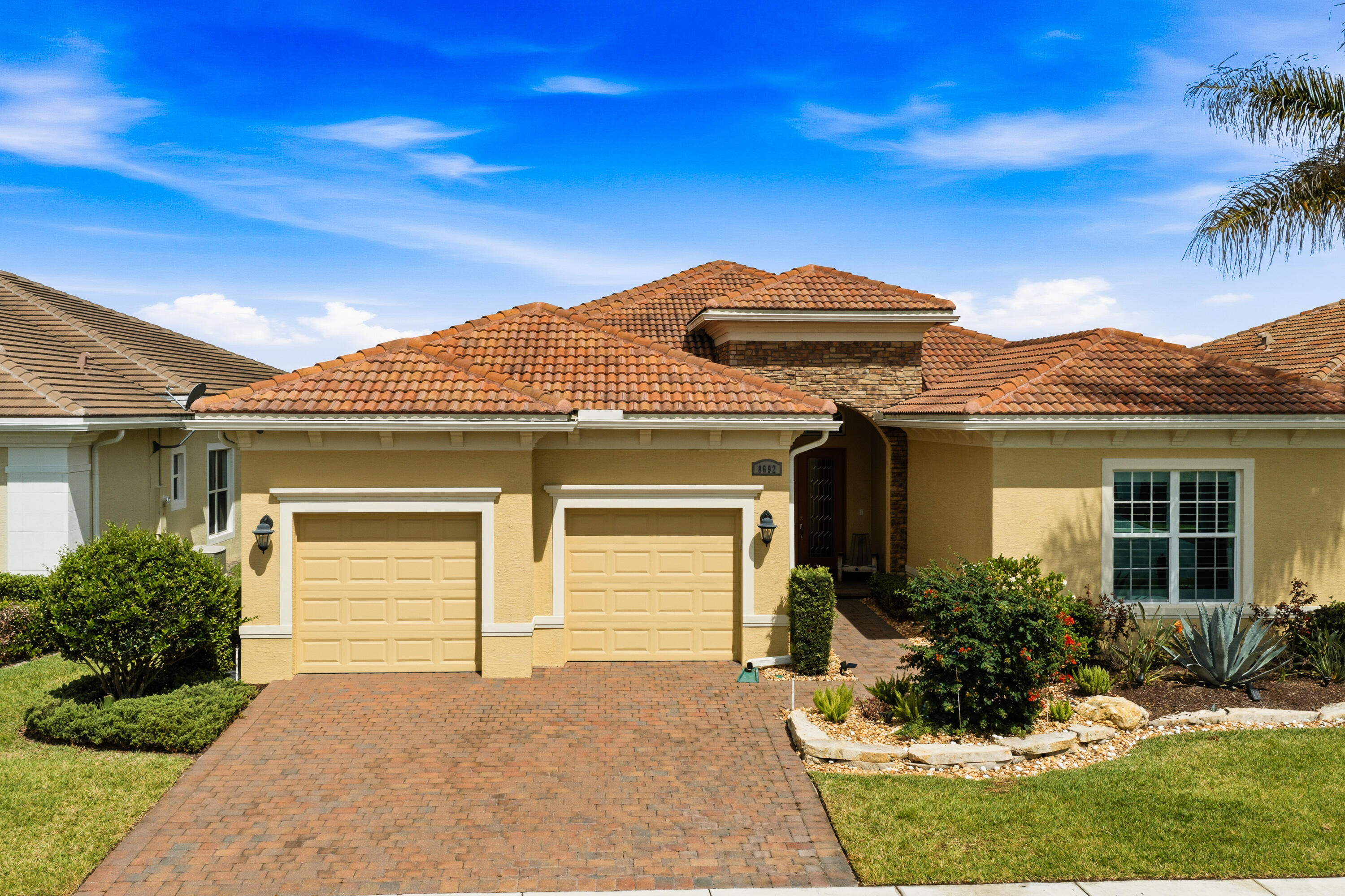 Welcome to this exceptional luxury residence showcasing over $200,000 in premium upgrades, designer finishes, and thoughtfully curated enhancements throughout. Located in one of Port Saint Lucie's most sought-after and rapidly growing communities, this stunning move-in-ready home offers the perfect blend of elegance, comfort, functionality, and modern Florida living. From the moment you arrive, you are welcomed by impressive curb appeal, upgraded landscaping, and meticulous attention to detail that immediately sets this property apart. Every aspect of this home has been carefully designed and upgraded to create a sophisticated yet inviting atmosphere ideal for both everyday living and entertaining. Step inside to discover a spacious open-concept floor plan filled with natural light, soaring ceilings, and expansive living spaces that flow seamlessly from room to room. The home features premium flooring, custom lighting fixtures, upgraded trim work, designer accents, and luxury finishes throughout, creating a refined and elevated living experience. At the heart of the home is the spectacular gourmet kitchen, designed to impress even the most discerning buyer. Featuring upgraded cabinetry, premium countertops, high-end stainless steel appliances, custom backsplash, designer fixtures, and an oversized center island, this kitchen offers both style and functionality. Whether hosting gatherings, preparing meals, or enjoying casual dining, the kitchen serves as the true centerpiece of the home. The spacious primary suite provides a luxurious private retreat complete with spa-inspired finishes, an elegant ensuite bathroom, oversized walk-in closets, and a peaceful atmosphere designed for relaxation. The additional bedrooms and flexible living areas offer endless possibilities for guests, a home office, fitness room, or multigenerational living. This home has been extensively upgraded with over $200,000 in improvements, including premium flooring, impact windows, upgraded landscaping, custom fixtures, enhanced indoor and outdoor living spaces, and numerous high-end details throughout. Every upgrade was carefully selected to maximize comfort, beauty, and long-term value. Step outside to your own private backyard oasis, where indoor and outdoor living come together effortlessly. The outdoor space is perfect for entertaining, relaxing, and enjoying Florida's year-round sunshine. Whether hosting family gatherings, enjoying quiet evenings, or creating your dream outdoor retreat, this property offers the ideal setting. Located in a highly desirable Port Saint Lucie community, residents enjoy convenient access to top-rated golf courses, shopping, dining, parks, entertainment, and major highways while still maintaining a peaceful residential atmosphere. This prime location continues to attract buyers seeking luxury living combined with convenience and strong long-term growth potential. This is a rare opportunity to own a truly upgraded and meticulously maintained luxury home where no detail has been overlooked. Homes offering this level of quality, investment, and designer craftsmanship rarely become available. Schedule your private showing today and experience everything this exceptional property has to offer.