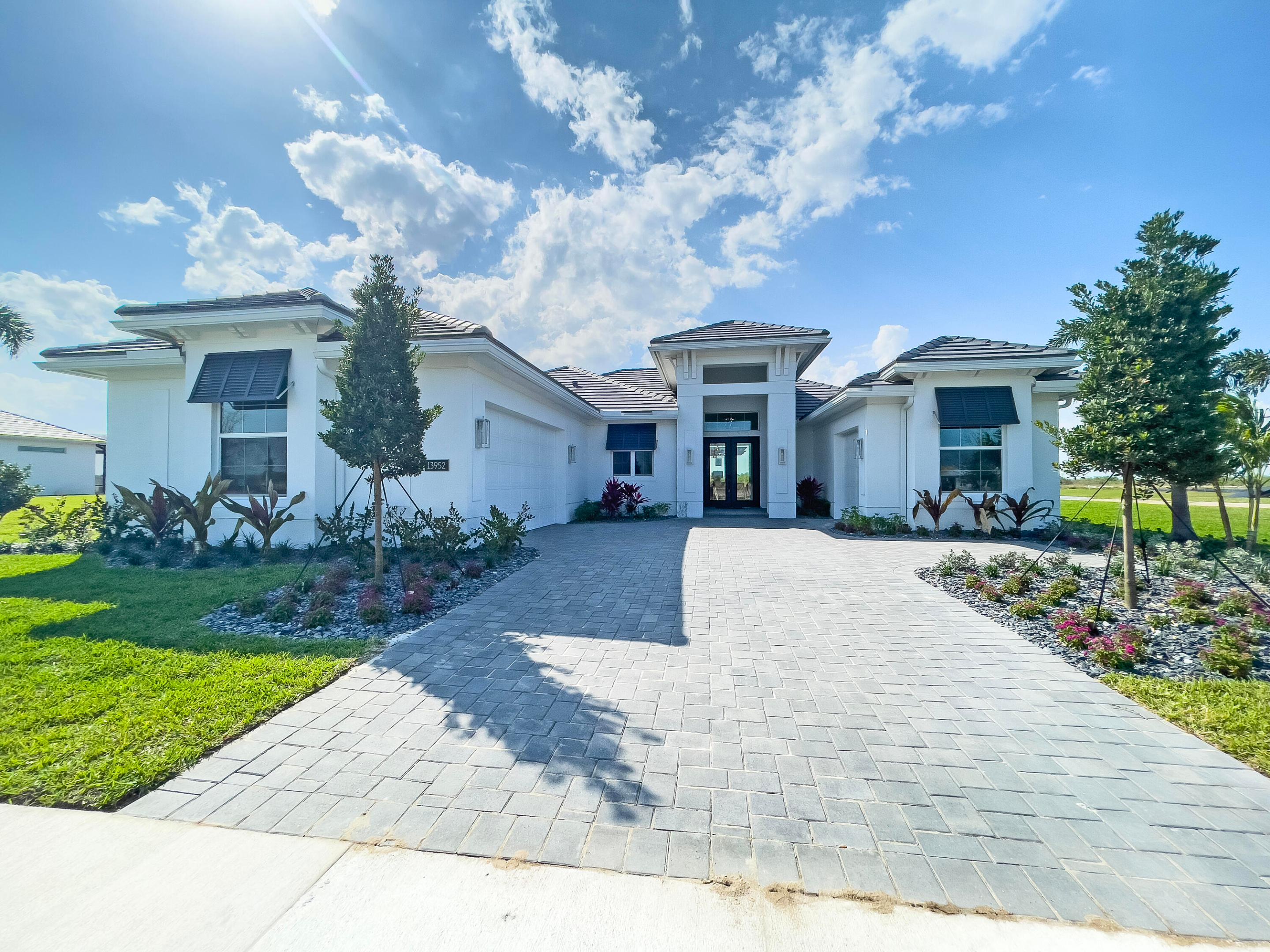 Home includes a private pool with 2 waterfalls, a sunshelf, a pergola and a spa! This Sage model is a fully furnished showcase residence. Offering 2,790 square feet of living space and a total of 3,776 square feet.  Featuring 3 bedrooms, 2.5 bathrooms, bonus room, club room and a 2-car garage plus a workshop garage.  Master bathroom includes a free-standing tub. The gourmet kitchen boasts stacked cabinetry with under-cabinet lighting, while the club room includes a stylish bar.  Custom lighting throughout, crown molding inside coffered ceilings and large-format porcelain wood plank tile flooring throughout the home.