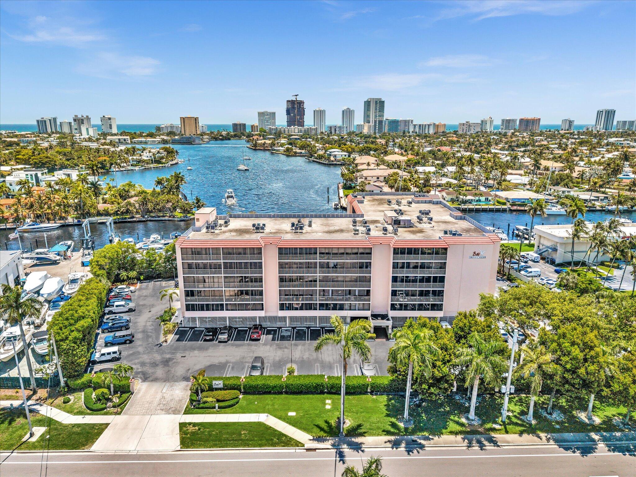 Imagine waking up to gentle waterfront breezes and spectacular morning sunrises, stepping onto your private oversized balcony overlooking sparkling Lake Santa Barbabra, and a skyline that includes the Waldorf and Ritz Carlton.  Bay Yacht Club offers one of South Florida's most appealing waterfront views and lifestyles-without the premium price tags of neighboring luxury hotspots.  Only a short bike ride (or walk), approx 1 mile, to the reimagined Pompano Beach Pier area, which features ocean-view restaurants, live music, pubs, seafood festivals, and a lively yet approachable atmosphere.  This clean and well-maintained condo unit has a spacious kitchen, freshly painted interior, renovated bathrooms, upgraded light fixtures and a NEW AC. This is a must see! Pompano Beach continues to see massive revitalization, new developments, and appreciation, making it an excellent choice for those not wanting to pay a premium to live in Fort Lauderdale or Boca.  If you're not highly considering purchasing in Pompano Beach, you should reconsider and do some further research.