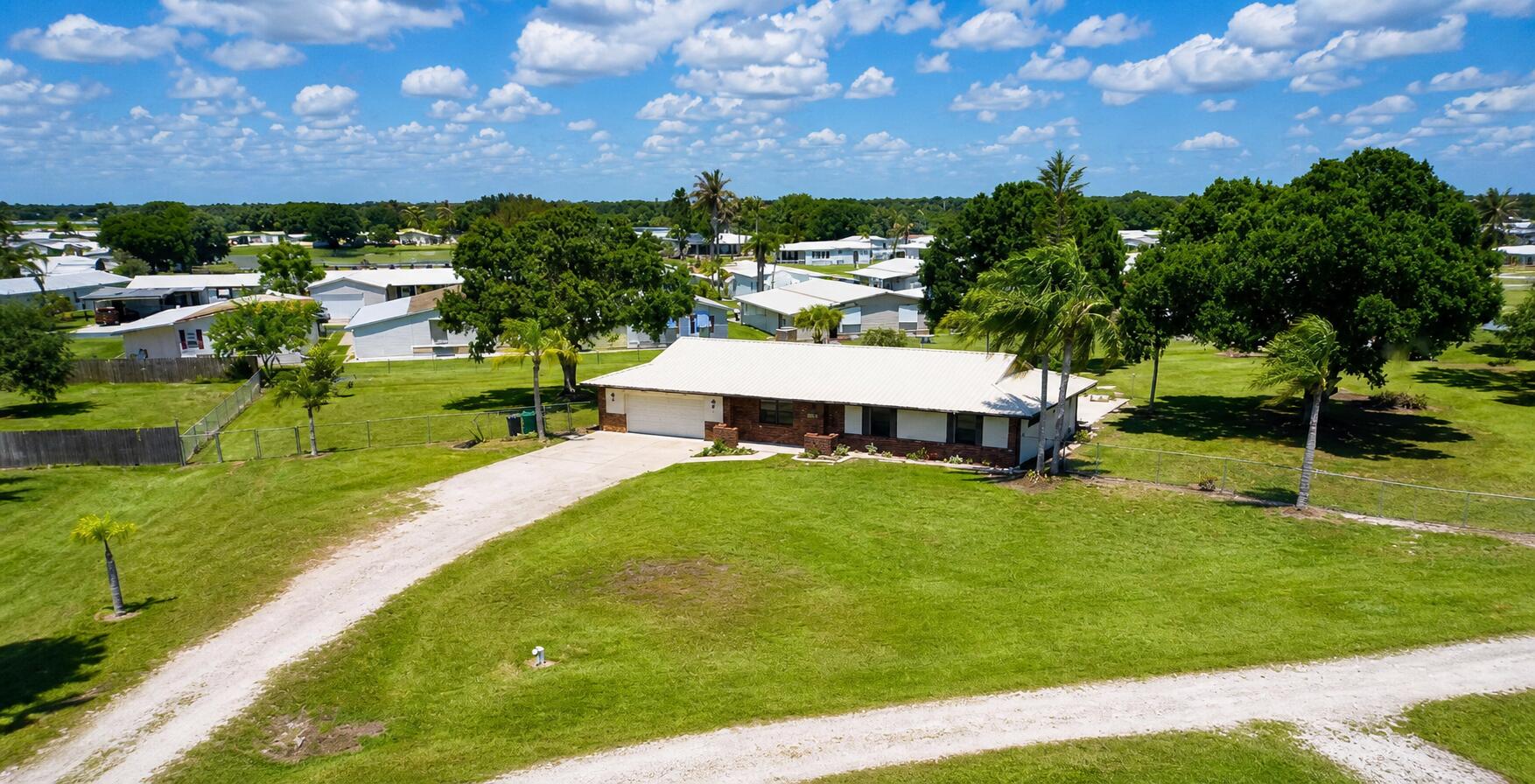 Located in the highly desirable southwest section of town, within the peaceful community of Ousley Estates. This CBS 3-bedroom, 2-bath home sits on a spacious 1.34-acre lot, with no HOA and connected to city water and sewer. This property offers both convenience and freedom—just a short drive to downtown and only minutes from Lake Okeechobee. The home features numerous upgrades, including new luxury vinyl plank flooring, a new water heater, updated ceiling fans, modern interior and exterior lighting, new blinds, and fresh paint throughout. The spacious kitchen is equipped with stainless steel appliances, epoxy countertops, and ample cabinet storage—perfect for everyday living and entertaining. Step outside to enjoy the covered patio and fully fenced backyard, complete with a pool featuring a new pump and equipment. Mature grandfather oaks and palm trees provide shade and a beautiful natural setting. The 11' x 40' shed offers plenty of additional storage or workspace. This move-in-ready home combines comfort, space, and location—truly a must-see. Schedule your private showing today!