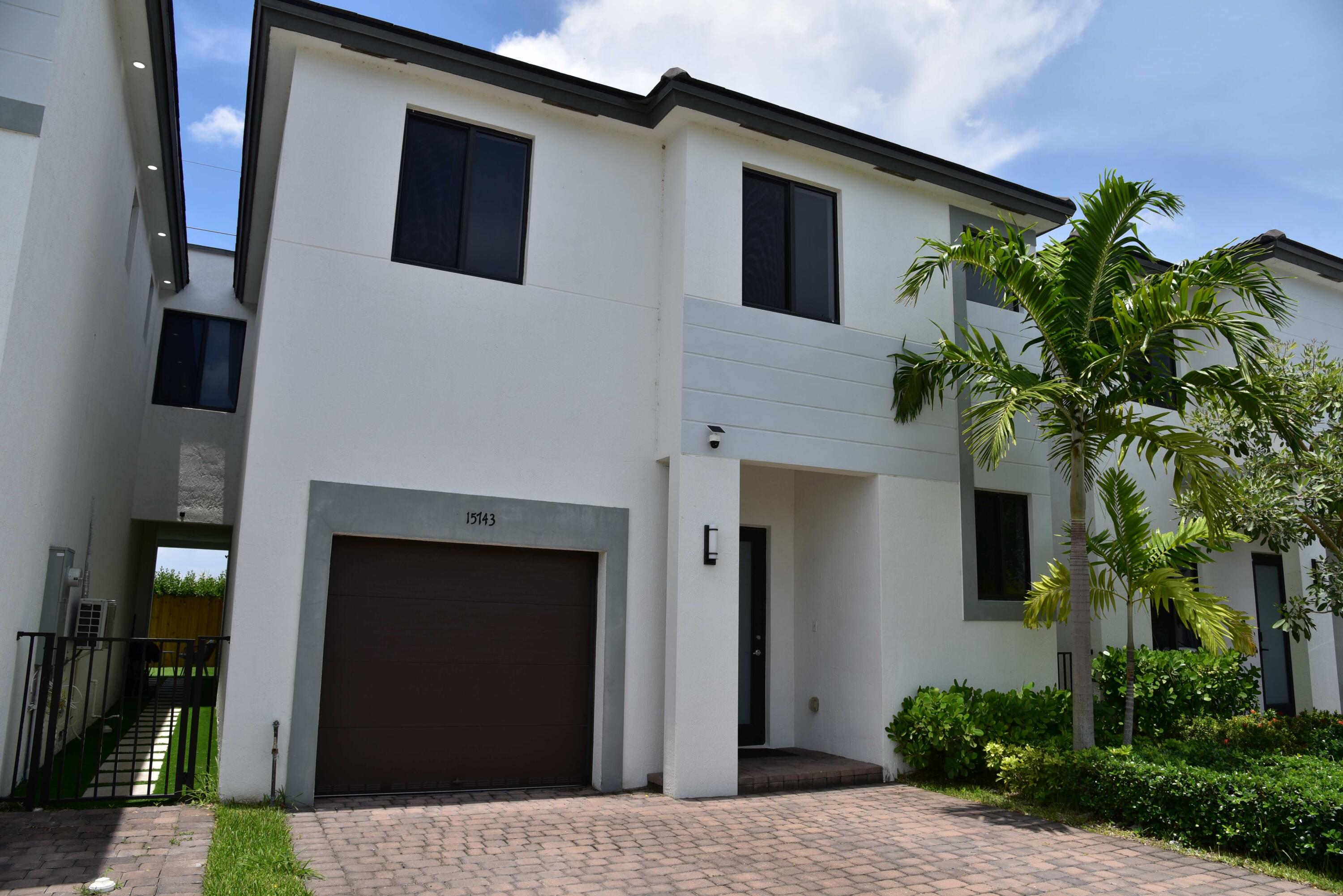 BACK TO SCHOOL SPECIAL:  Beautifully updated home near top rated schools. This spacious turn-key unit is almost New.  Built in 2023 it offering comfort, natural light, and an excellent Miami location. This spacious 4-bedroom, 3.5-bath home features an open-concept layout, a bright living area, elegant kitchen with quartz countertops, quality finishes, and access to a private brick-paved patio ideal for relaxing or entertaining. The primary suite is massive and includes a large walk-in closet. Enjoy porcelain floors, impact windows and doors, attached garage and two assigned parking spaces in front of the home, guest parking, and a convenient location.  Easy access to Turnpike,  Miami Airport, Zoo Miami, stadiums, great entertainment parks, shopping and fine dining,