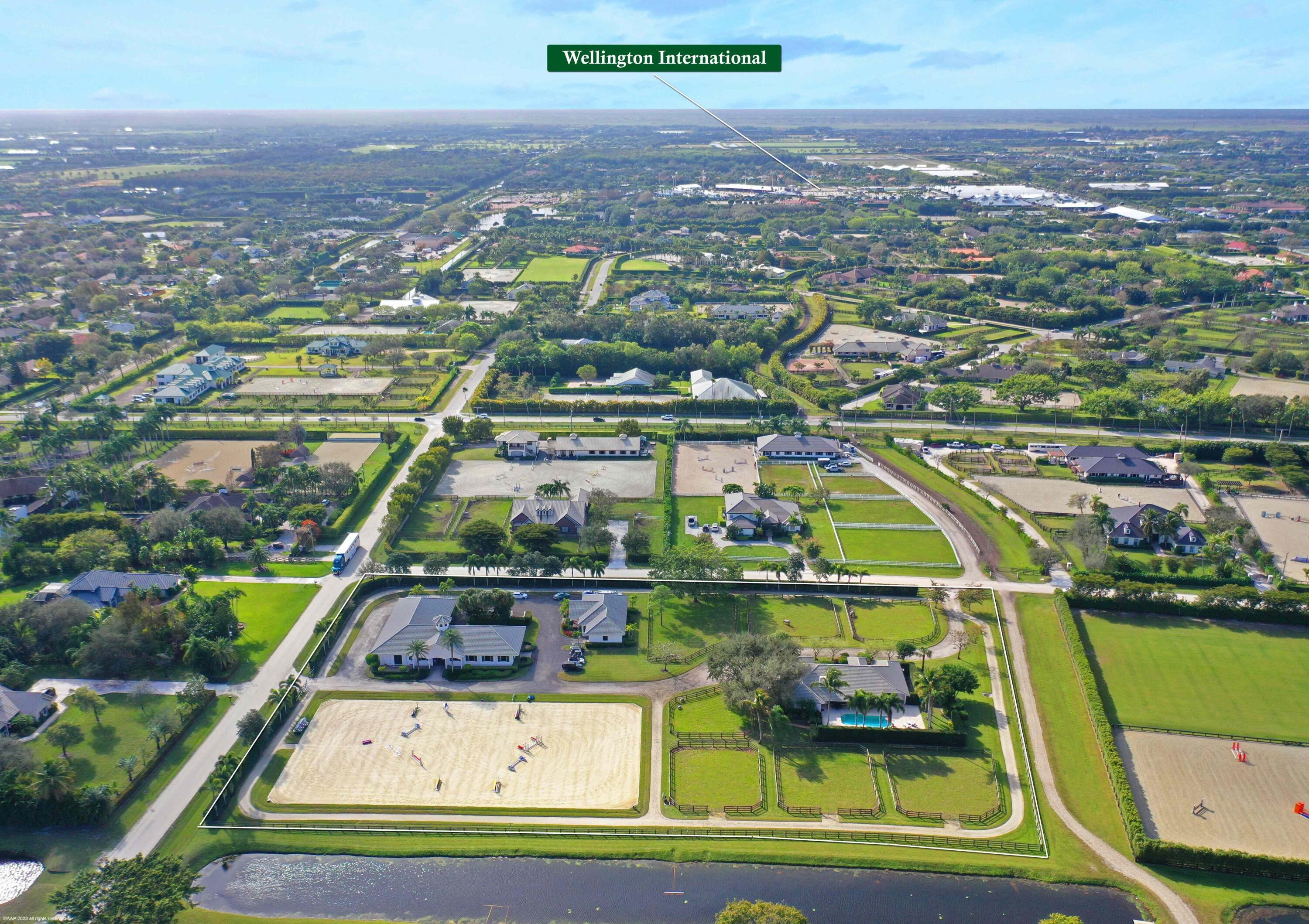 Pristine and professional, 16-stall center-aisle stable on, 4+ AC. 7 Shaded and lush paddocks, 2 feed rooms with laundry, 2 tack/office rooms, 4 wash stalls. Two 2BR, 2BA apartments. - 125 by 225 Ebb and flow system footing ring by Travis Gould JTWG Equestrian Surfaces- 1/3 mile irrigated all-weather track around the 4 acres - ample client parking. Located on the bridlepath. Just a short walk to the WEF showgrounds.