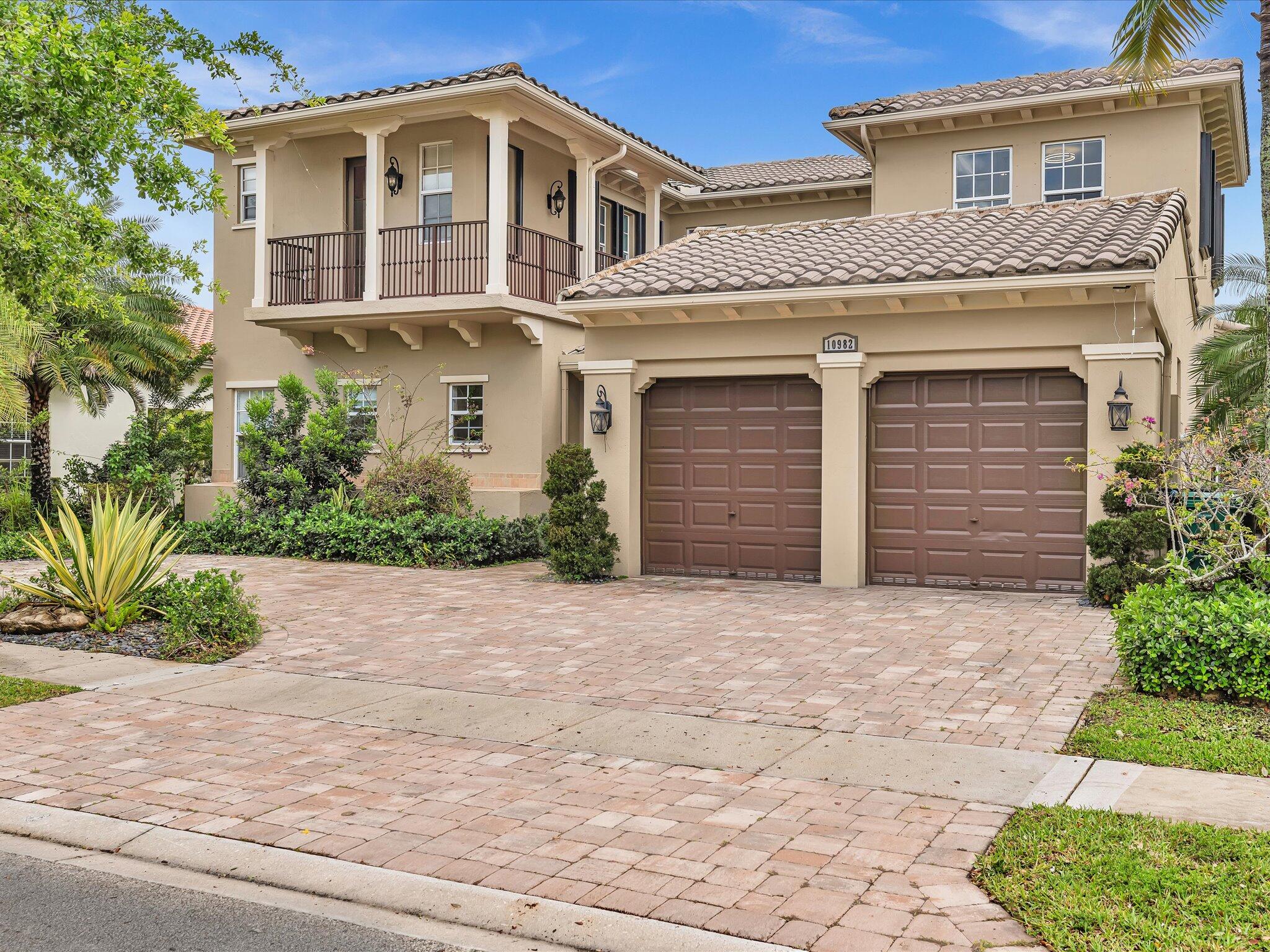 Simply stunning waterfront home located in one of Parkland's most sought-after communities, known for its A-rated schools and exceptional lifestyle. Impressive curb appeal welcomes you with manicured landscaping, charming balconies, and an idyllic gated courtyard. Inside, a light-filled interior showcases soaring 2-story ceilings, expansive glass doors, and elegant finishes throughout. The crisp white chef's kitchen features a large island, quartz countertops, and seamless flow to the outdoor living space. Enjoy a serene backyard with tranquil water views, pool and lush landscaping. Luxurious primary suite with custom closets and spa bath. Private guest/in-law suite with separate entrance. True South Florida resort-style living!