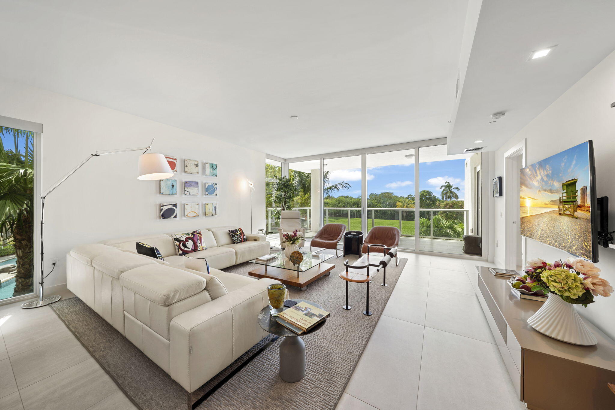 Experience Akoya luxury in this stunning corner residence with breathtaking golf views and a private foyer entry into this 3/3.5 plus den tropical paradise.  Floor-to-ceiling impact windows fill this home with natural light.  Gourmet kitchen boasts Italkraft cabinetry, Sub-Zero & Wolf appliances and quartz counters. The primary suite offers a serene retreat with a spa-inspired bath, and all bedrooms have en-suite baths.  Includes 2 parking spaces, valet parking, 24-hour front desk, resort-style pool, fitness center, social party room, card room & more! Located within the gates of the #1 Private Residential Country Club in the Nation, Boca West offers a world class spa, aquatics & fitness center, 4 Championship golf courses, 24 tennis courts, 25 pickleball courts, 8 dining venues & more!