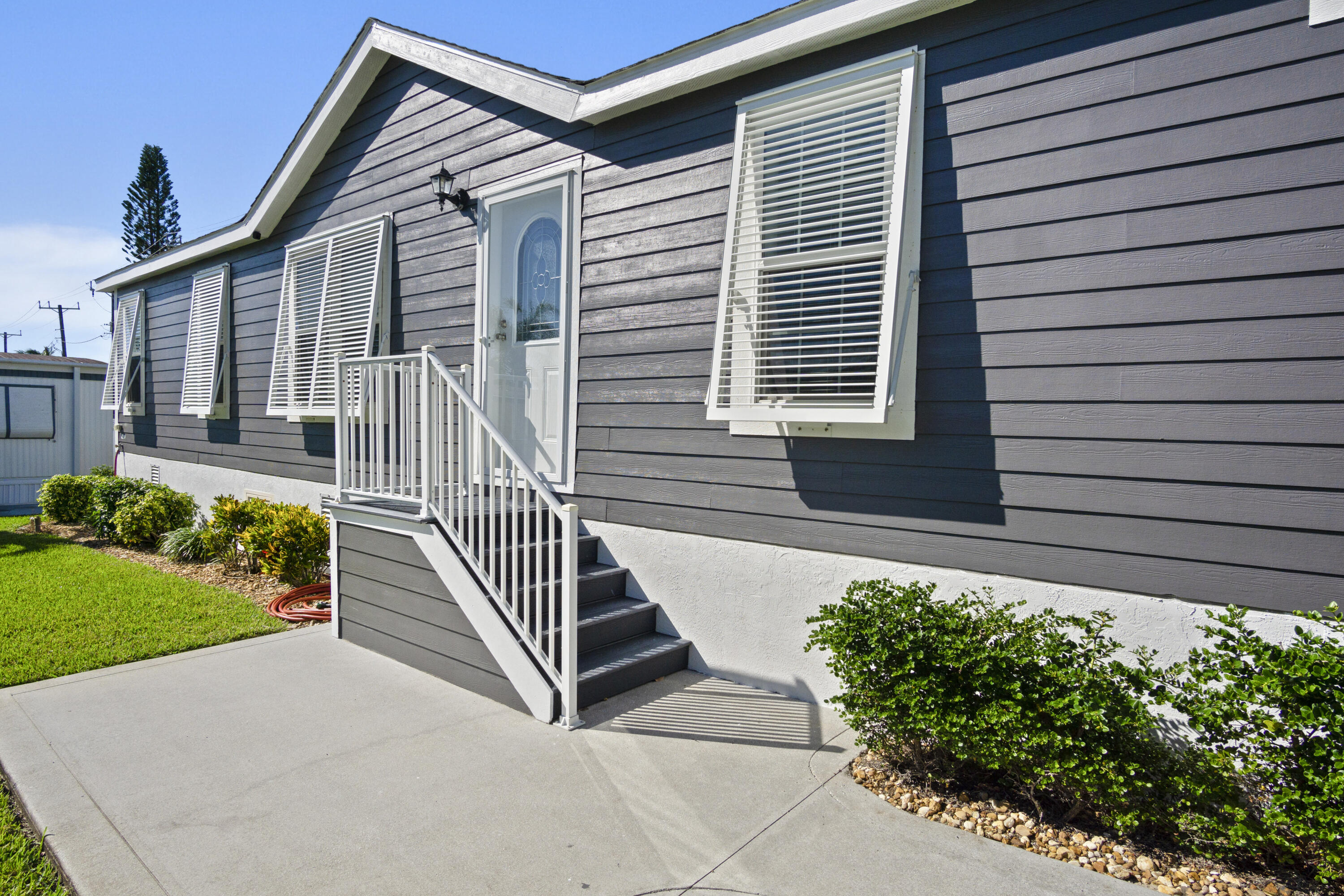 ONE OF A KIND! You OWN the land, no HOA. This 4 bedroom 2 bath manufactured home redefines expectations, blending beautiful design with superior craftsmanship. Built to latest specs, this spacious open concept invites entertaining with the gourmet kitchen, granite counters throughout, and tray ceilings. The walk in shower as well as a tub fit every need. YOU MUST SEE THIS HOME TO BELIEVE IT. Too many upgrades to list, but a few are large crown molding and base molding, chair rail, 3/4 inch subfloor, 2x6 exterior framing, 2.x4 interior framing. Ridgeway is not age restricted or pet restricted. Only minutes from beaches, boating, dining, golf, Ridgeway enjoys the cooling breezes from the nearby Intercoastal Waterway. See Features list in document section additional information.