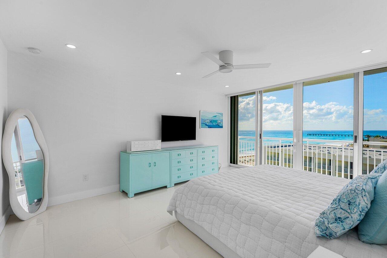 Palm Beach oceanfront, fully renovated in 2025. Move-in ready 2BR/2BA split plan with ocean sunrises and Intracoastal sunset views. Dual primary suites with designer finishes throughout. Bright modern interior featuring large-format porcelain tile, recessed lighting, electric blinds, and new floor-to-ceiling hurricane impact sliders. Open kitchen with Calacatta-style quartz countertops, full-height backsplash, custom cabinetry, and Samsung Bespoke appliances. Spacious suites with generous closets and spa-inspired baths with floating vanities, dual sinks, walk-in showers, and LED mirrors. A+ oceanfront building with wide beach, heated pool, fitness center, BBQ, storage, and beach cabanas. Co-op permits 3-6 month rentals after 1 year ownership.