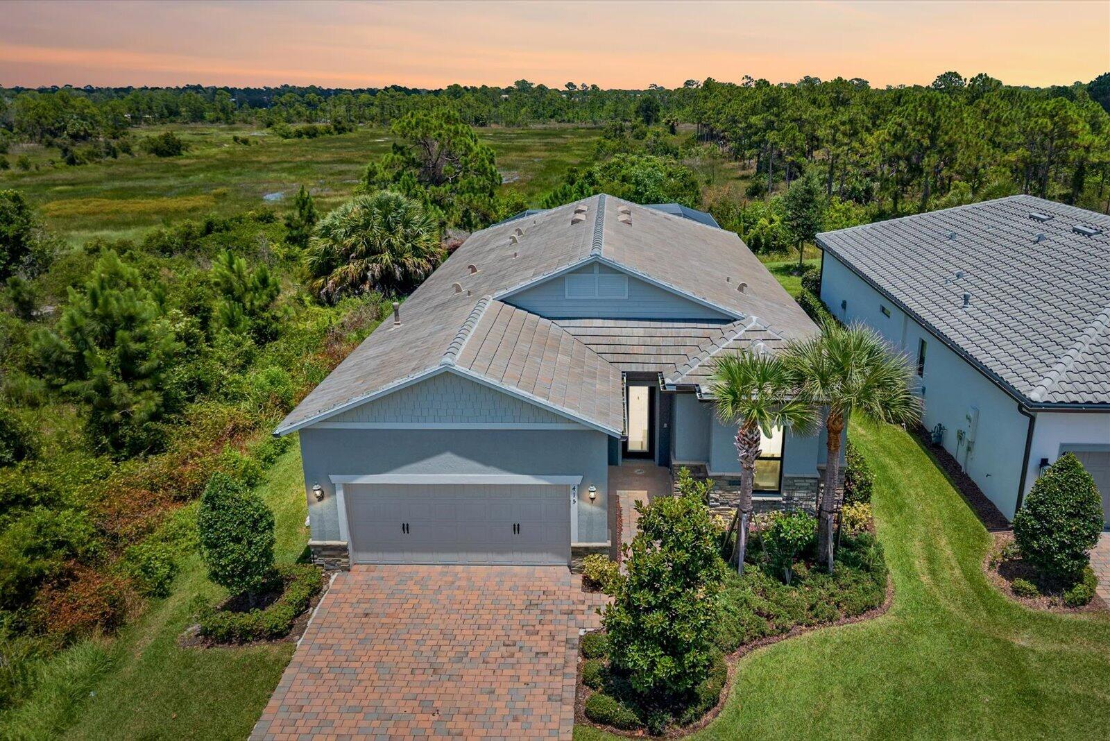 Premium corner homesite in Veranda Gardens with only one neighboring home, no rear neighbors, and breathtaking preserve and wetland views.  Surrounded by nature and offering an exceptional level of privacy, this is a truly unique setting within the community.  Built in 2022, this 3-bedroom, 3-bath residence with a flexible bonus room that can easily serve as a 4th bedroom, office, or den offers 2,153 square feet of thoughtfully designed living space filled with natural light and modern upgrades throughout.    The open-concept floor plan is ideal for everyday living and entertaining, featuring a gourmet kitchen with a gas cooktop, wall oven, upgraded appliances, true exterior-vented range hood, oversized island, and formal dining area.  Impact glass throughout provides peace of mind and energy efficiency. Step outside to your private backyard retreat featuring a smart-controlled heated saltwater pool and spa, expansive screened lanai, and tranquil preserve views.  Designed with premium, high-efficiency equipment, the pool system delivers exceptional performance while requiring minimal maintenance throughout the year.     Residents enjoy resort-style amenities including a clubhouse, fitness center, resort pool, tennis, pickleball, walking trails, playground, and dog park, all conveniently located near shopping, dining, and major highways.