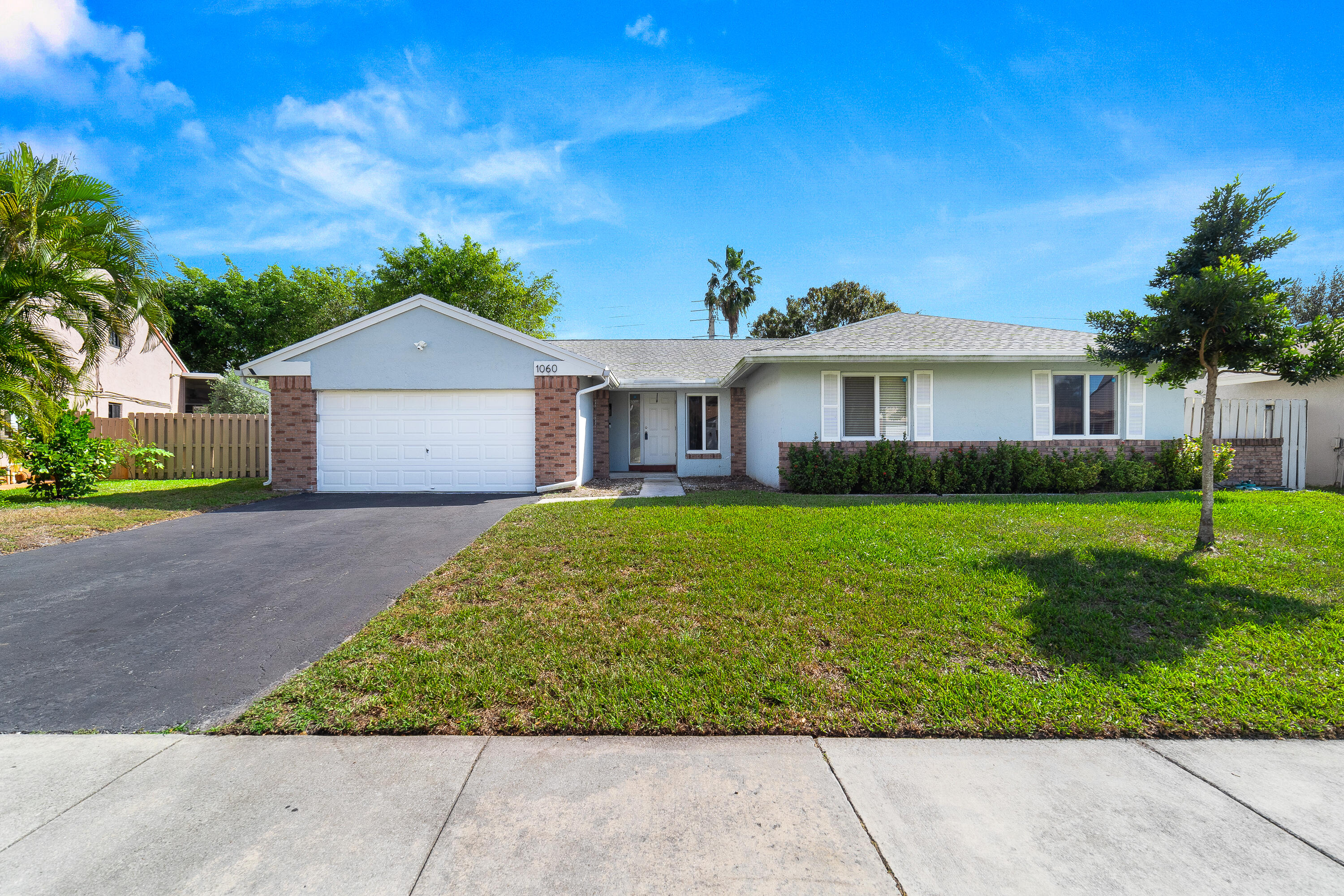 Welcome home to this ideal 4 bedroom 2 bath opportunity located in the highly sought after Shenandoah community. Professional pics coming soon! As soon as you enter, you immediately notice the high ceilings and abundant natural light. The split bedroom floorplan provides great flexibility and privacy. The home offers newer vinyl flooring in the bedrooms with tile flooring in the living areas. The large kitchen boasts a huge breakfast bar that leads out to the family room, perfect for entertaining. The primary bedroom boasts tons of storage space and a partially updated bath. Out back, the possibilities are endless with tons of room for a future pool, play or entertaining. Newer a/c, large 2 car garage and long driveway for added parking round out the highlights. Located in the heart of Davie, this opportunity provides a fantastic location not far from gorgeous beaches, shopping and quick access to highways. Please make sure to check out the 3D virtual walk through and schedule an appointment today!