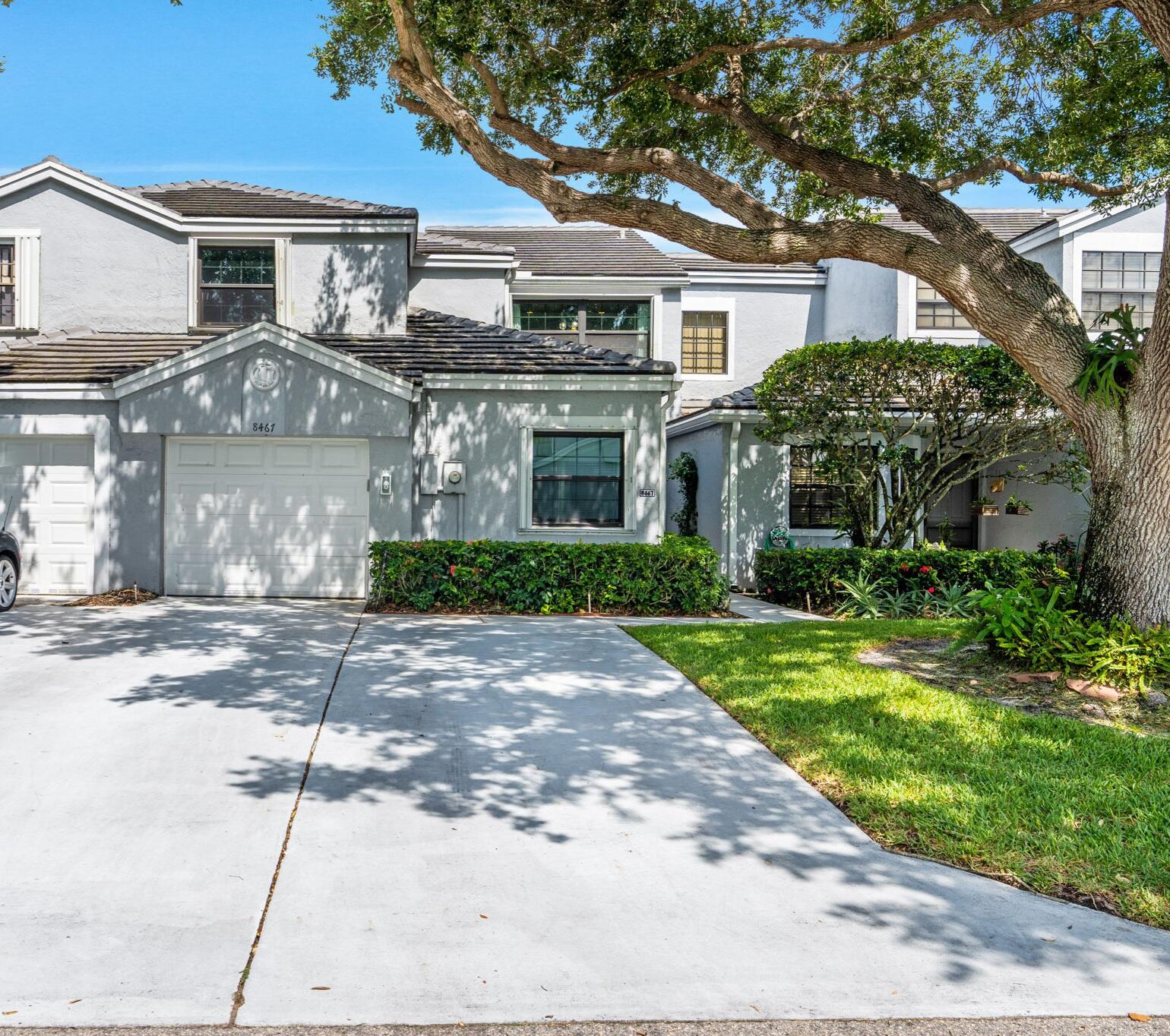 Beautifully maintained 3-bedroom, 2.5-bath townhome with a 1-car garage and serene lake views. The spacious floor plan features a first-floor primary suite with dual closets, vaulted ceilings, laminate and tile flooring throughout. Upstairs offers two additional bedrooms plus an open loft area ideal for a home office, den, or flex space. Enjoy relaxing lake views from the screened patio and take advantage of the community pool. Pet-friendly, all-ages community with an oversized 4-car driveway and accordion hurricane shutters throughout.  Double-insulated windows (2020) Hurricane-impact garage door (2023) Refrigerators/shelving located in the garage do not convey with the sale.