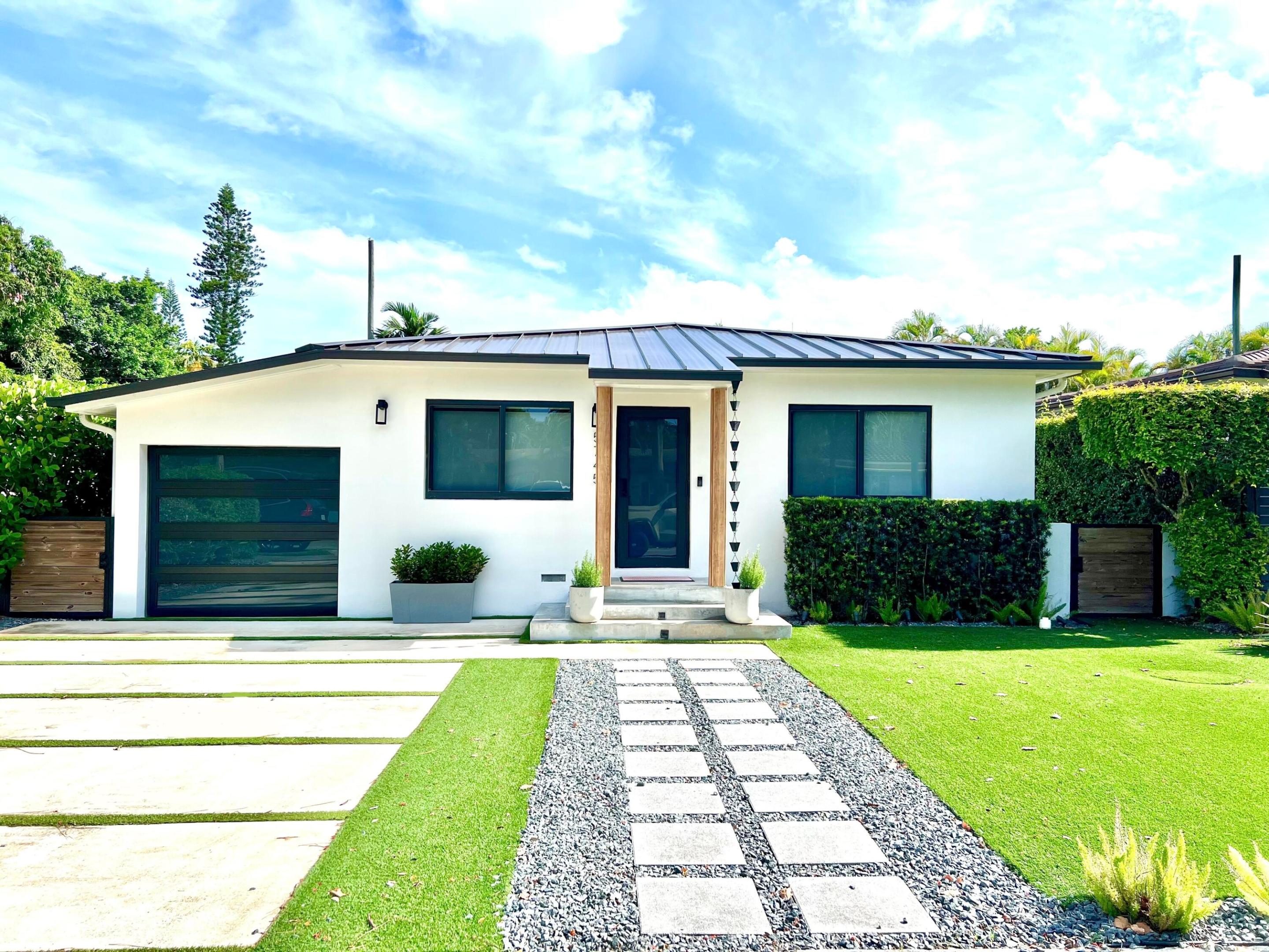 Beautifully reimagined contemporary home in Biltmore Heights. Completely renovated in 2021, this 3-bedroom, 3.5-bath open-concept gem offers refined finishes, impact windows and doors, all-new electrical, plumbing, metal roof, and septic system. The sleek kitchen features modern fixtures, large quartz waterfall island, and seamless flow into living and dining areas. A serene primary suite includes custom built-ins, walk-in closet, and spa-inspired bath. Enjoy outdoor living in the low-maintenance backyard with custom pergola, Trex decking, whirlpool spa, and putting green. Upgrades include an air-conditioned, extra long 1-car garage with storage loft. Ideally located within walking distance to University of Miami and just 1 mile from South Miami's shopping and restaurants. Owner/Agent