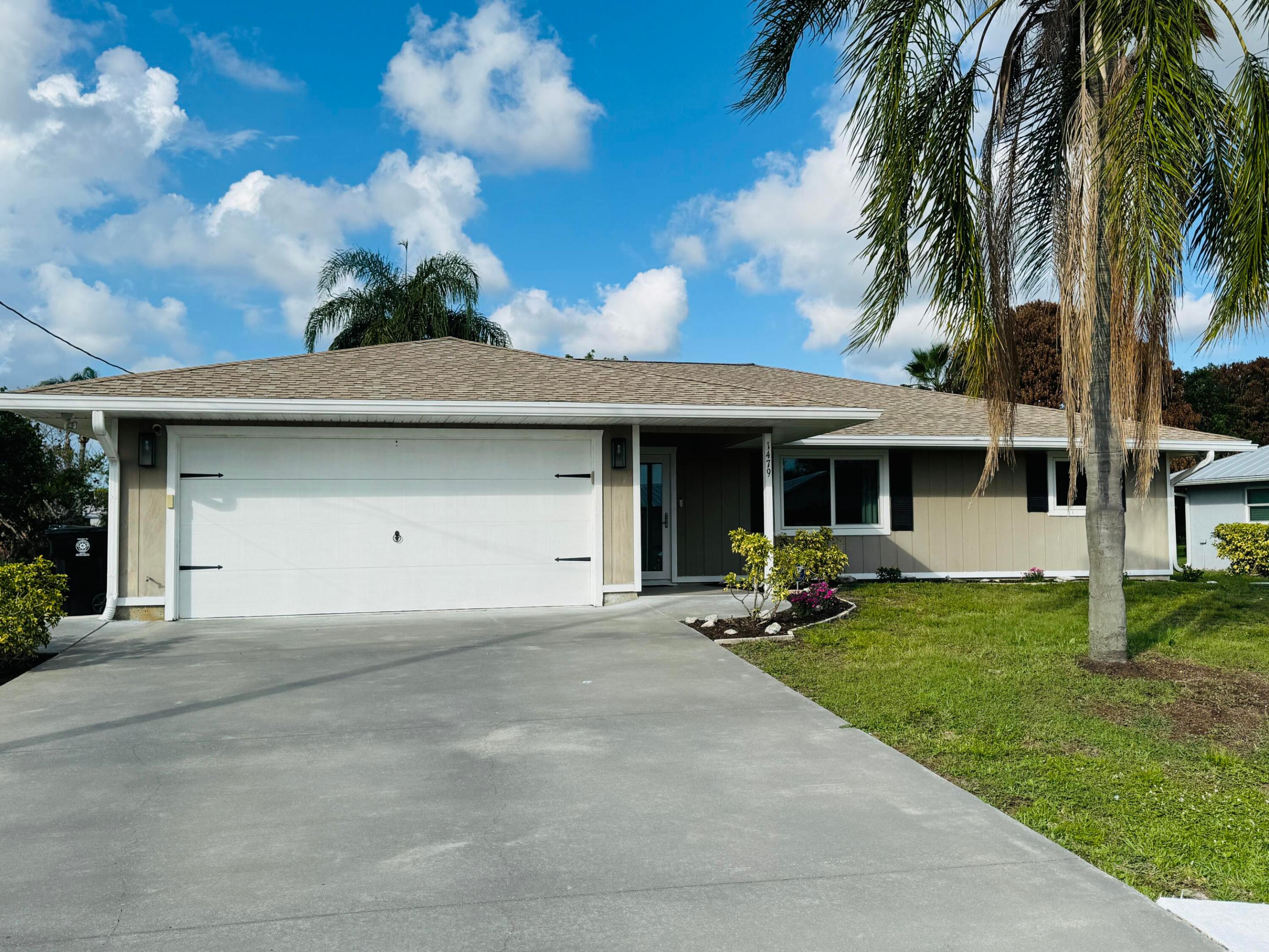 This beautiful 3 Bedroom, 2 Bathroom, 2 Car Garage home is located in the desirable community of Sandpiper Bay. No HOA fees! Enjoy the perfect kitchen with black granite countertops, stainless steel appliances, soft close drawers and wood plank porcelain tile. Vaulted Ceilings, Spacious split bedrooms provide privacy along with plenty of storage including a walk-in closet. Home is updated throughout. Large patio with screen enclosure. Newer hurricane Impact Windows! Just minutes to the beach, shopping, restaurants, the Treasure Coast Mall, Botanical Gardens and the Saints Golf Course. Truly the perfect location!