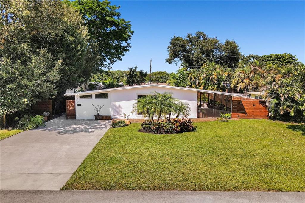 Mid Century Home with Modern Updates throughout. Filled with Natural Light, 2 bedrooms 1 bath plus a flex space for home office or 3rd bedroom w/a large storage area. Custom Blinds, French Doors, Vaulted Ceilings Custom Accent wall in the Living Room. Screened Porch overlooking large yard w/ room for a pool & expansion. Separate Utility/ Laundry Room. New Modern 6ft Privacy Fencing,2018 Electric Panels, 2016 Roof. Open Kitchen w/ Counter Seating & a Pantry. Updated fixtures & Lighting throughout. Nest Thermostat, full alarm system & outdoor security lighting. Shady Banks offers 2 parks with Volleyball, Tennis Courts Walking Paths and a Riverfront Preserve to Paddle Board/Kayak. Surrounded by the New River, with one way in/out this is the hidden gem neighborhood in Ft Lauderdale. A MUST SEE