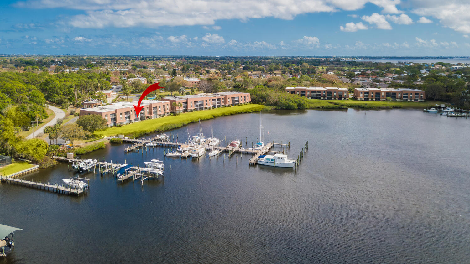 Boater's delight! Experience waterfront living with wide views of Kitching Cove, a deep water pocket for larger boats to ride out storms. Relax on your screened patio while watching sailboats glide by, along with sea otters and ospreys.This updated first-floor condo features 1,314 sq ft of living space, w/Two large bdrms, Two full baths, updated kitchen, laundry rm. Just a short walk from the heated community pool, woodworking shop, billiards room, clubhouse, tennis courts, and more. Tarpon Bay Marina is only steps away and can accommodate Boats up to 50 feet, with DOCKAGE FEES of $2.25 per foot.  Tarpon Bay is an active over-55 community located in the heart of Sandpiper Bay.