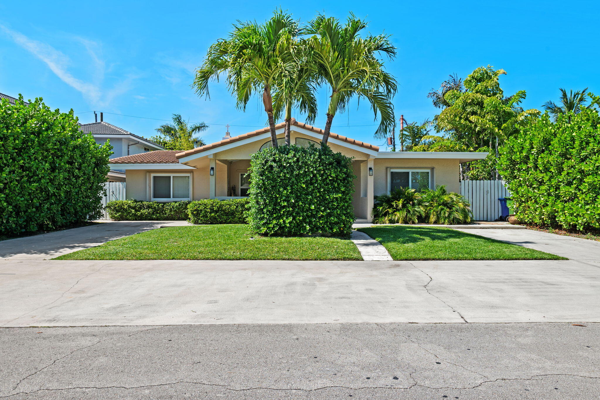 Luxury Coastal Living in Highly Sought-After Lauderdale-By-The-Sea! Welcome to your dream home in the charming seaside village of Lauderdale-by-the-Sea — where coastal elegance meets relaxed small-town living. This beautifully updated 4-bedroom, 3-bathroom residence offers the perfect blend of style, comfort, and the ultimate South Florida lifestyle. Step inside to discover new luxury vinyl plank flooring throughout and an inviting open-concept layout designed for effortless living and entertaining, tiled bathrooms and Florida Room complete this home. At the heart of the home is the stunning renovated chef's kitchen, thoughtfully designed with high-end granite countertops, a spacious breakfast bar, electric cooktop, wall oven, eat-in dining area, newer appliances, coffee/wine bar with beve rage refrigerator, and custom enclosed storage, providing both sophistication and functionality. The spacious great room seamlessly combines the living and dining areas, highlighted by a cozy fireplace that creates a warm and inviting atmosphere for gatherings. Just beyond the kitchen is a bright and versatile Florida room/bonus room offers additional living space perfect for relaxing, entertaining, a game room, home office, or enjoying tranquil evenings reading. Retreat to the luxurious primary suite, featuring a walk-in closet and a beautifully updated spa-inspired bath complete with an oversized jetted soaking tub, expansive tiled shower, dual granite vanities, private water closet, and additional closet, creating the perfect private retreat. Three other spacious bedrooms, one with a private ensuite bathroom are perfect for guests or family members. Step outside to your private fenced backyard oasis, designed for true Florida living and entertaining. Enjoy evenings under the patio pergola or the front porch, ideal for outdoor dining, relaxing with friends, or weekend gatherings. For those who desire a private pool, the spacious backyard offers room to add one and create your own personal outdoor retreat. Additional features include a new roof in 2022 and A/C systems replaced in 2019 & 2020, offering peace of mind for years to come. During the current owners' 40 years of ownership, this home has never flooded. Ideally located just a short walk or bike ride to the beach and vibrant town of Lauderdale-by-the-Sea, you'll enjoy boutique shopping, waterfront dining, charming cafés, live music, fishing piers, snorkeling, diving, and the town's famous walkable beachside atmosphere. With nearby golf, major shopping, dining, and easy access to everything South Florida has to offer, this home delivers the perfect combination of luxury, convenience, and coastal charm. A rare opportunity to own a beautifully updated home in one of South Florida's most desirable beachside communities!
