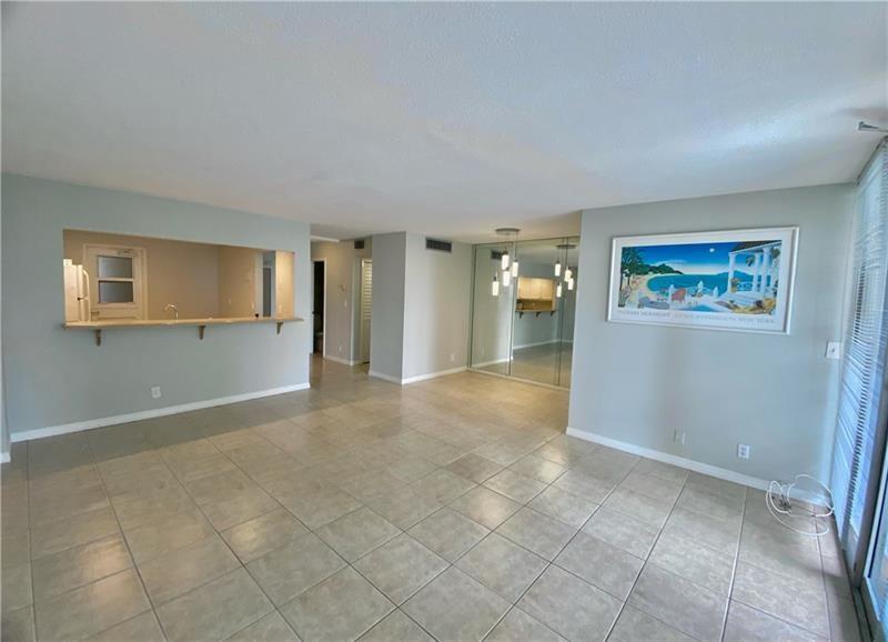 Beautiful spacious 1 bedroom 1.5 baths condo right across the street from the beach. Gorgeous Ocean and Intracoastal Views. This unit is nicely remodeled with lots of storage and closet space. Great building, very quiet, clean, 24 hrs security guard, pool, new gym, BBQ grill and amazing beach just steps away. Also short walk to Birch State Park. Close to shopping, restaurants and everything you need. Bayview school district. Come see it-wont last long.
