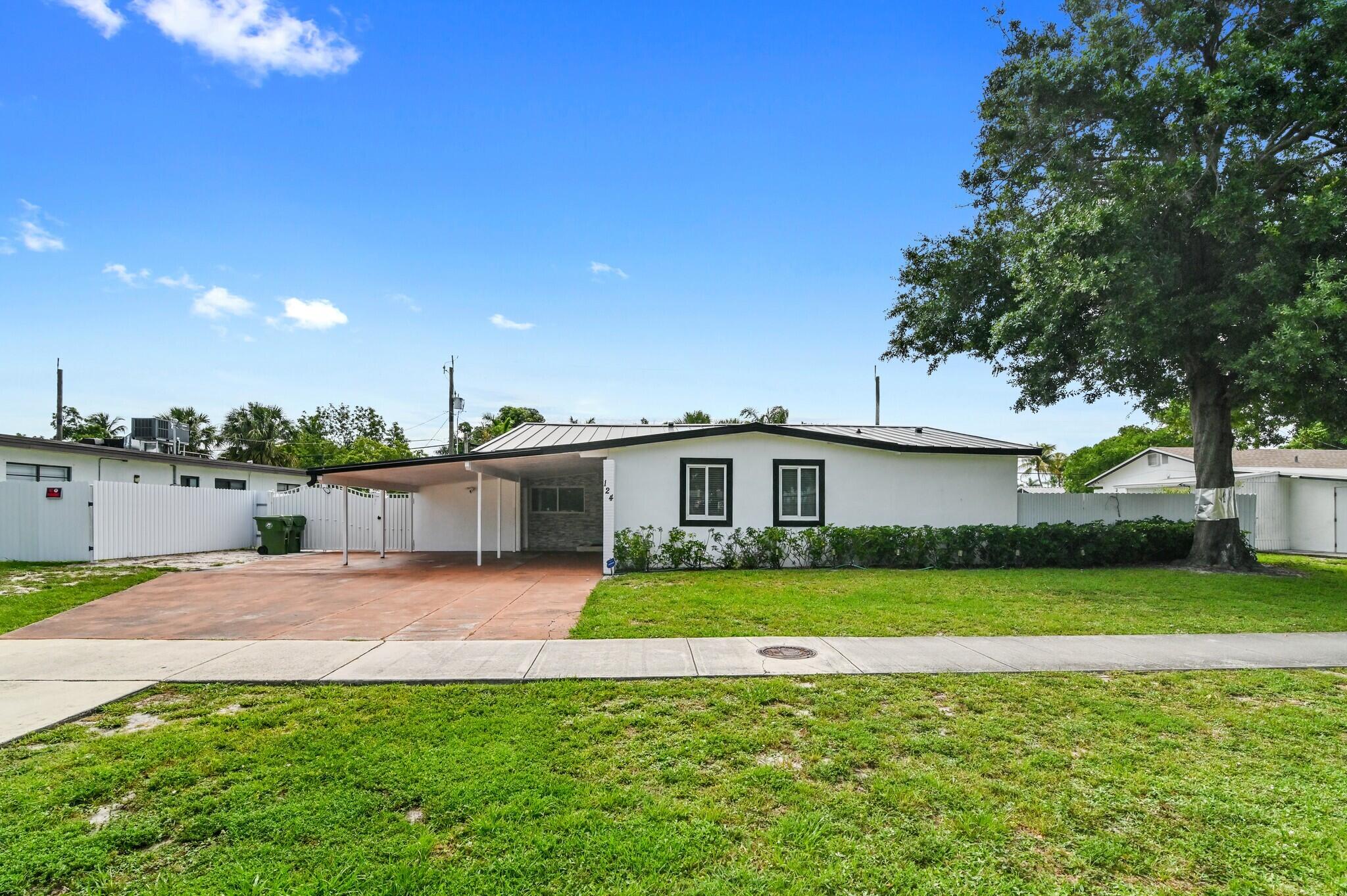 Turnkey 3BR/2BA single-family home in Palm Springs, Fl, currently a successful income-producing Airbnb. Low-maintenance Florida living: durable metal roof, updated kitchen and baths, tile throughout — no carpet. The backyard is the showpiece — resort-style pool with sun shelf and spa, covered lanai, full outdoor kitchen, pergola, and fully fenced yard. A separate storage room offers flex potential for a home office or extra living space, and the oversized lot has room for an ADU or future expansion. Near schools/shopping/dining, it works as a primary residence, vacation home, or turnkey short-term rental investment.