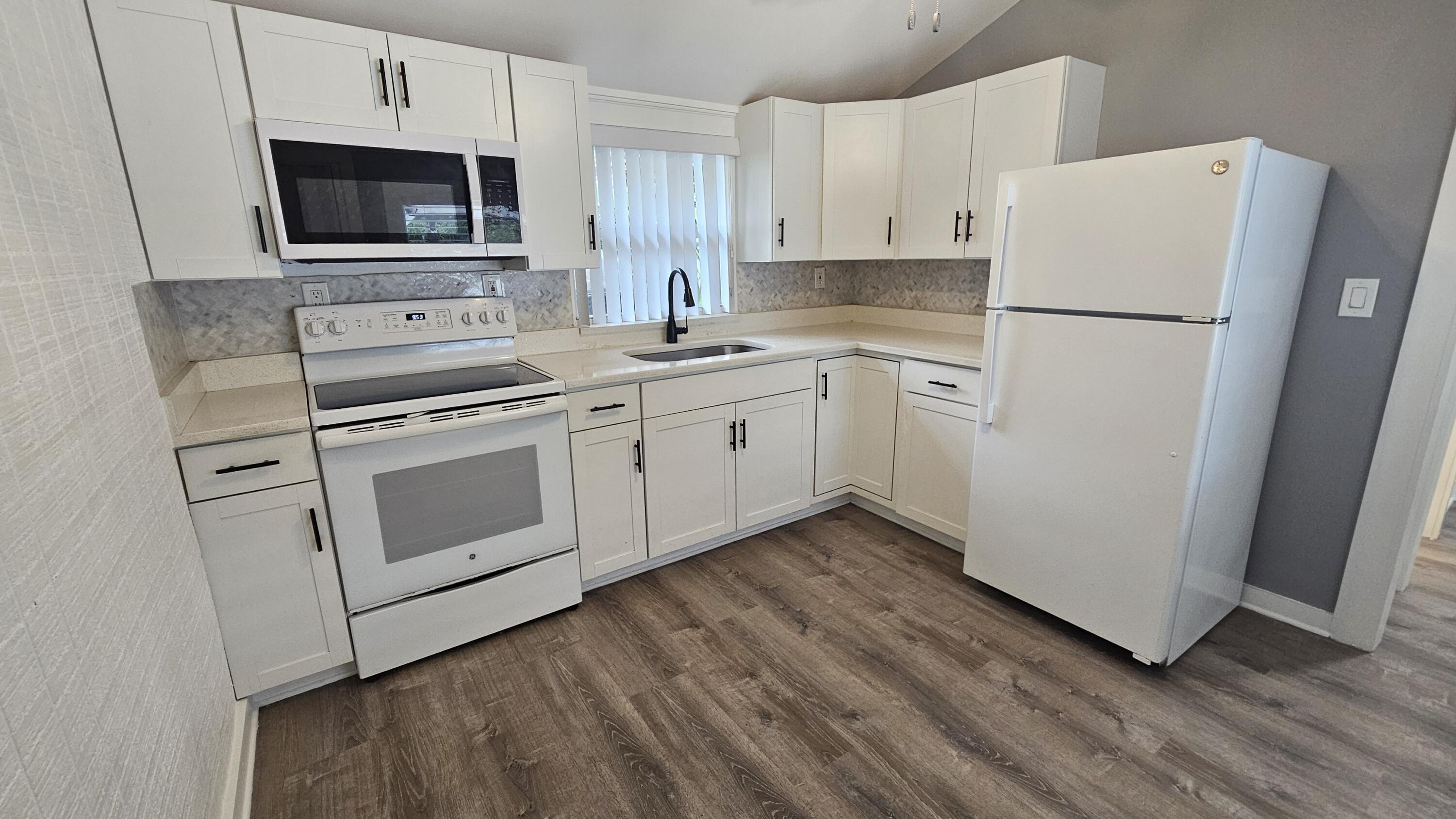 This newly remodeled 1 bed 1 bath apartment features new kitchen, new bath, new flooring, new mini-split A/C. fresh paint. LARGE open patio, and a cozy private yard space. This unit is available for immediate move in. Approval can be within 24 hours - and NO HOA! Min. credit: 600. Be close to downtown West Palm Beach without the hustle and bustle! One block from shopping and restaurants. Schedule your tour today!