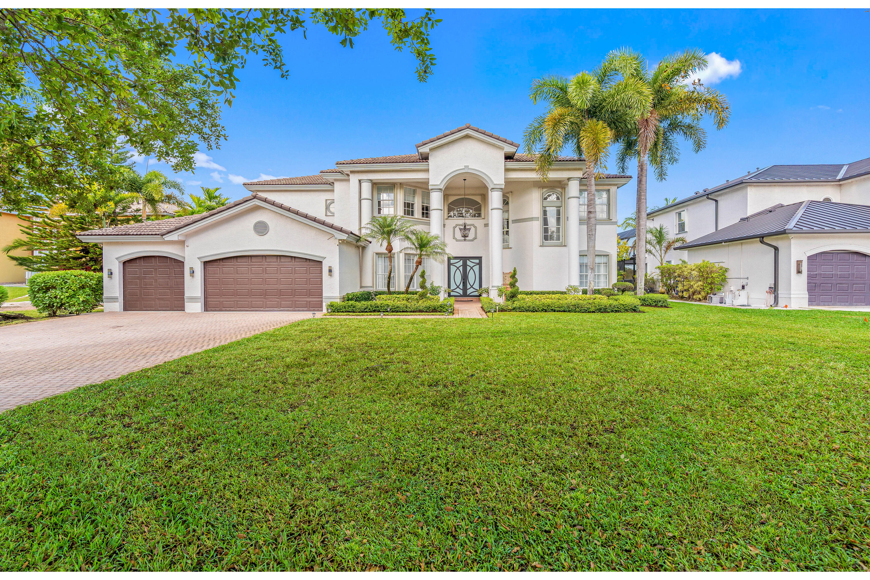 Stunning lakefront residence with pool on an oversized 19,762 SF lot, offering space, privacy, and beautiful water views. Elegant interior featuring marble floors throughout and a desirable floor plan with 2 bedrooms on the first floor. Completely updated gourmet kitchen and designer bathrooms, enhanced by new modern lighting. Enjoy outdoor living with a private pool overlooking the lake, perfect for entertaining. Additional features include accordion shutters, new electric water heater, new generator, and A/C 2004. A rare opportunity combining luxury, comfort, and an exceptional lot size.