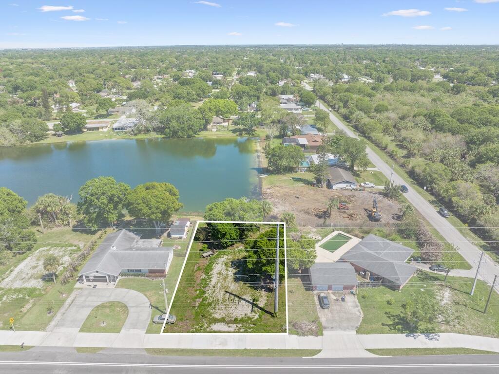 Build your Florida dream home on this oversized 0.26-acre lakeview homesite in the desirable Lakewood Park community. Already improved with a house pad in place, this property offers a valuable head start toward construction while maximizing picturesque water views. Enjoy the flexibility of a spacious lot with room for outdoor living, a pool, or additional parking. Conveniently located near shopping, dining, schools, parks, golf, and everyday amenities, with easy access to US-1 and I-95 for commuters. Just a short drive to the beaches, boat ramps, fishing, and waterfront attractions of the Treasure Coast. Whether you're building now or investing for the future, this lakefront opportunity combines location, lifestyle, and potential. Possible package deal with neighboring lot also available.