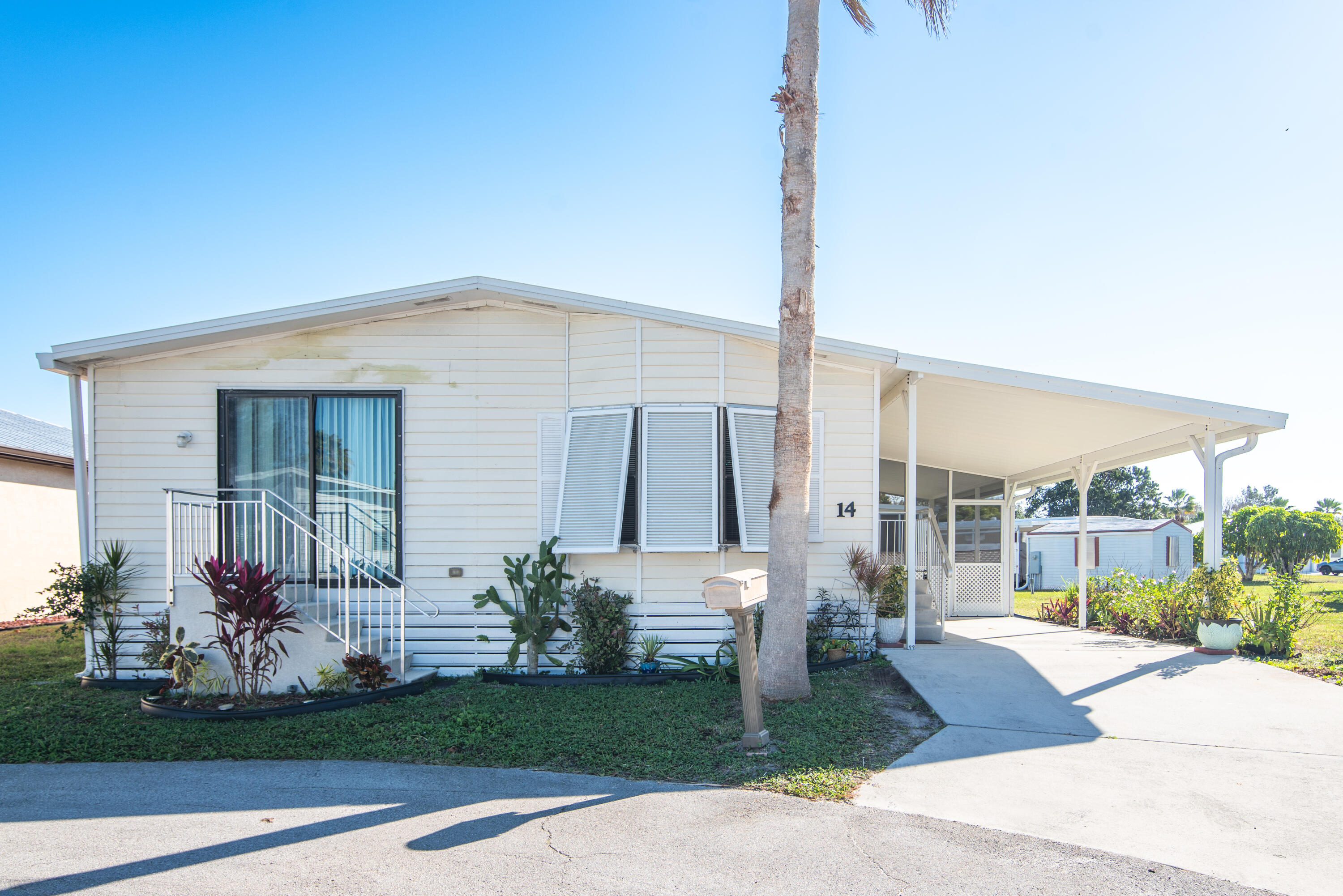 Welcome to 14 Jacaranda Lane, a fully furnished mobile home located in the highly desirable 55+ Spanish Lakes community in Port St. Lucie. This charming residence is being sold with all furnishings included, perfect for seasonal living, downsizing, or a low‑maintenance Florida retreat.  The home has been well cared for and offers a warm, comfortable layout ready for its next owner.   Spanish Lakes is known for its active lifestyle, friendly atmosphere, and convenient access to shopping, dining, medical facilities, and beautiful local beaches. Residents enjoy a variety of community amenities and a welcoming environment designed for relaxed, enjoyable living.  This is a great opportunity to secure a furnished home in one of Port St. Lucie's most popular 55+ communities Very motivated seller. Will consider all offers