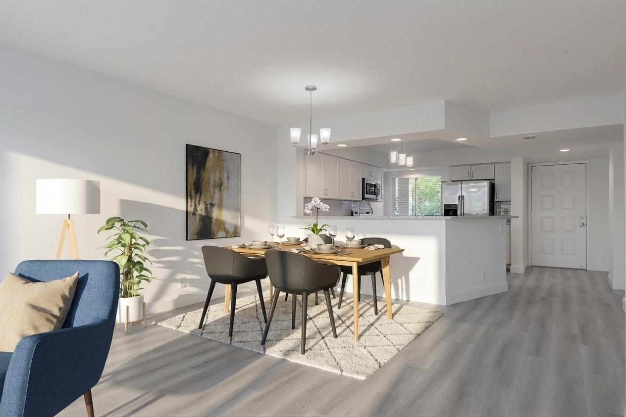 1ST FIRST YEAR OF MONTHLY HOA FEES WITH FULL PRICE OFFER! Enjoy a modern, casual ambiance in this light and bright 2 BR/2 BA unit boasting new vinyl flooring, a beautiful newly renovated kitchen. Spacious living area opens to a screened patio with breathtaking pool views.  Located in the much sough after section with a wealth of amenities: sparkling pool, tennis courts, gym, basketball & tennis courts, shuffleboard, media room, billiards, clubhouse, BBQ area, and more. Near "The Pomp" projected for 2027 with new shops, dining, high end condo units and daily entertainment.