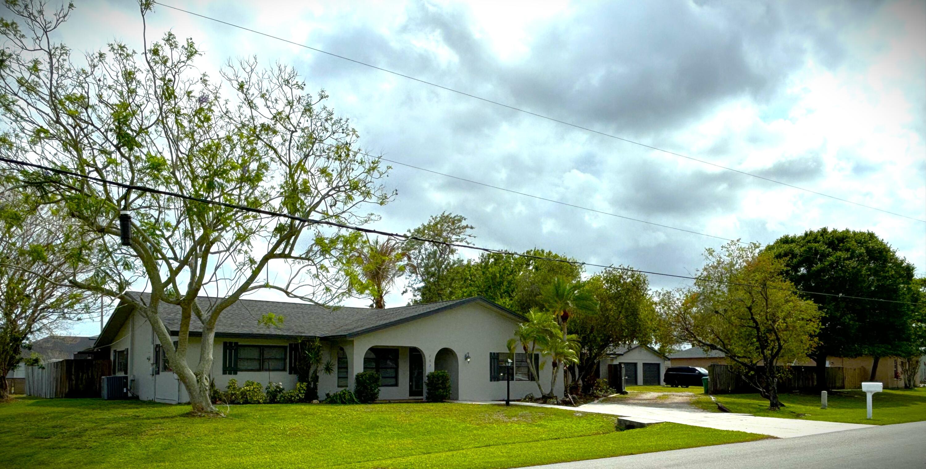 Rare double corner lot with a large detached two car garage with water and electricity.  Location,location,location close two turnpike and I-95. Restaurants, drugstore, gas, fast-food, grocery's and  much more minutes away. Bayshore Heights, great friendly, safe neighborhood  near PSL police Dept.