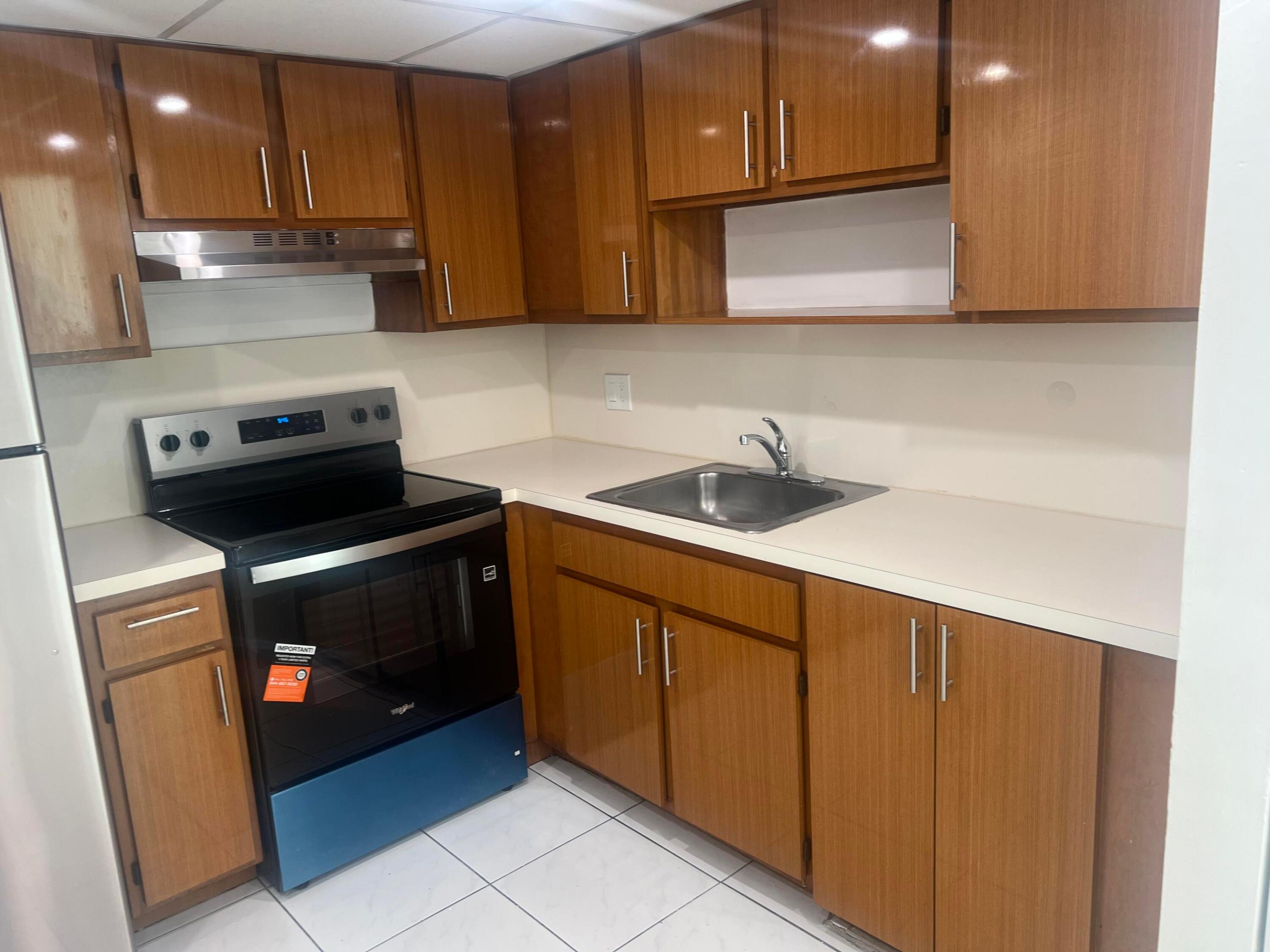 Totally remodeled 2 Bed/2Bath condo!!!!Great location. The unit has top of the line stainless steel new appliances including the washer and dryer. Kitchen with new ceiling, recessed lighting and new s/s exhaust vent. Freshly painted, neutral colors. Upgraded bath with new modern tile and vanity. New laminate wood flooring in bedrooms, tile in social areas. Master bedroom with a walking closet & a full new closet in the second bedroom. Unit is spacious & bright with open balcony. Walking distance to Supermarkets, restaurants , Malls, cinema . Near Turnpike, FIU, Schools. Easy to show.