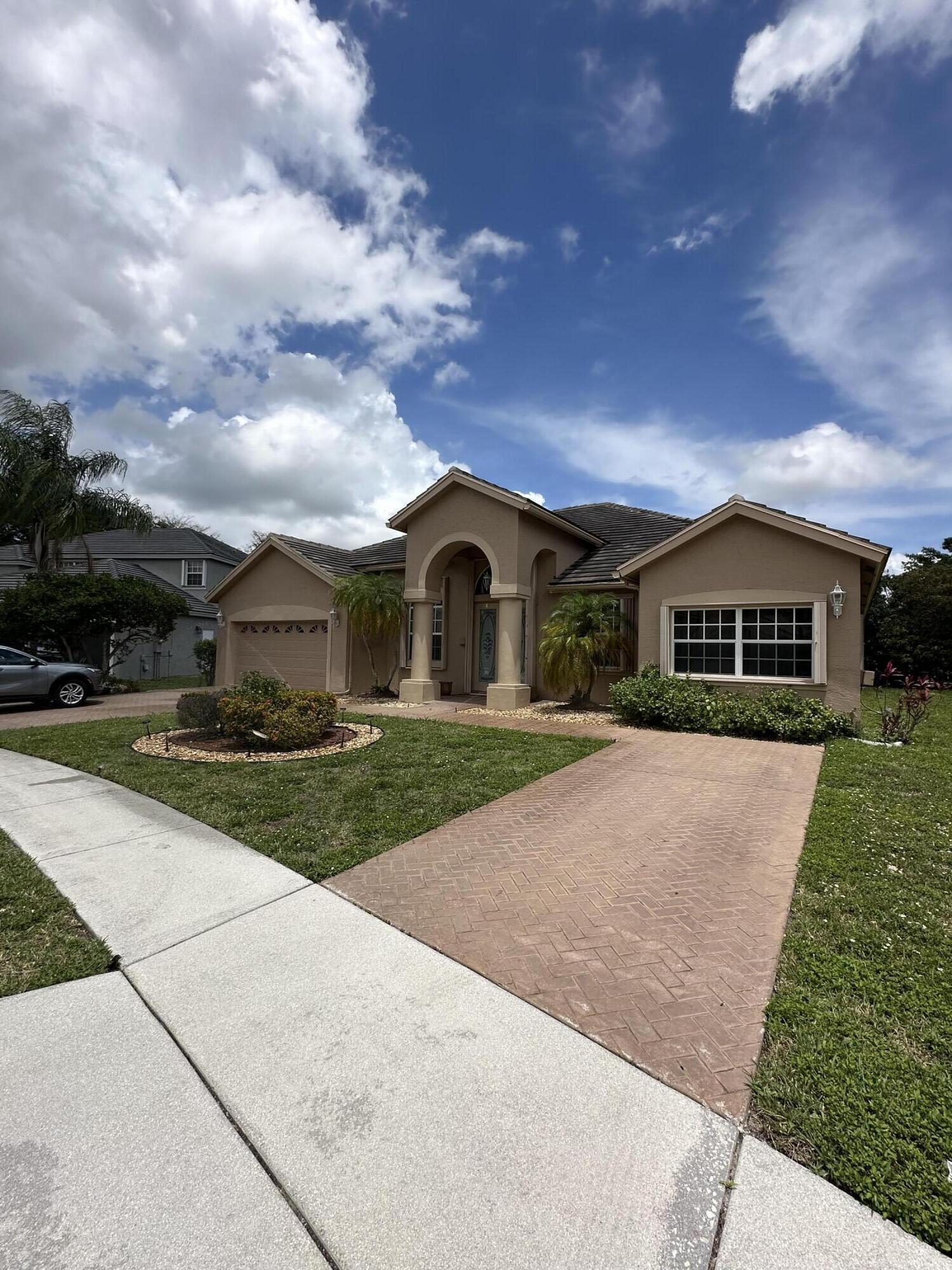 This five-bedroom, three-bath home in gated Boca Falls offers an open split floor plan with vaulted ceilings, a granite and stainless kitchen, tile flooring throughout, and a generous primary suite. A dedicated projector room is a rare plus, and the screened-in pool and patio make outdoor living effortless.  A-rated schools and full resort-style amenities: clubhouse, pool, gym, play area, tennis and basketball courts. Minutes to major highways, shopping, and restaurants. Move-in ready and priced to lease quickly in a community where rentals do not last.