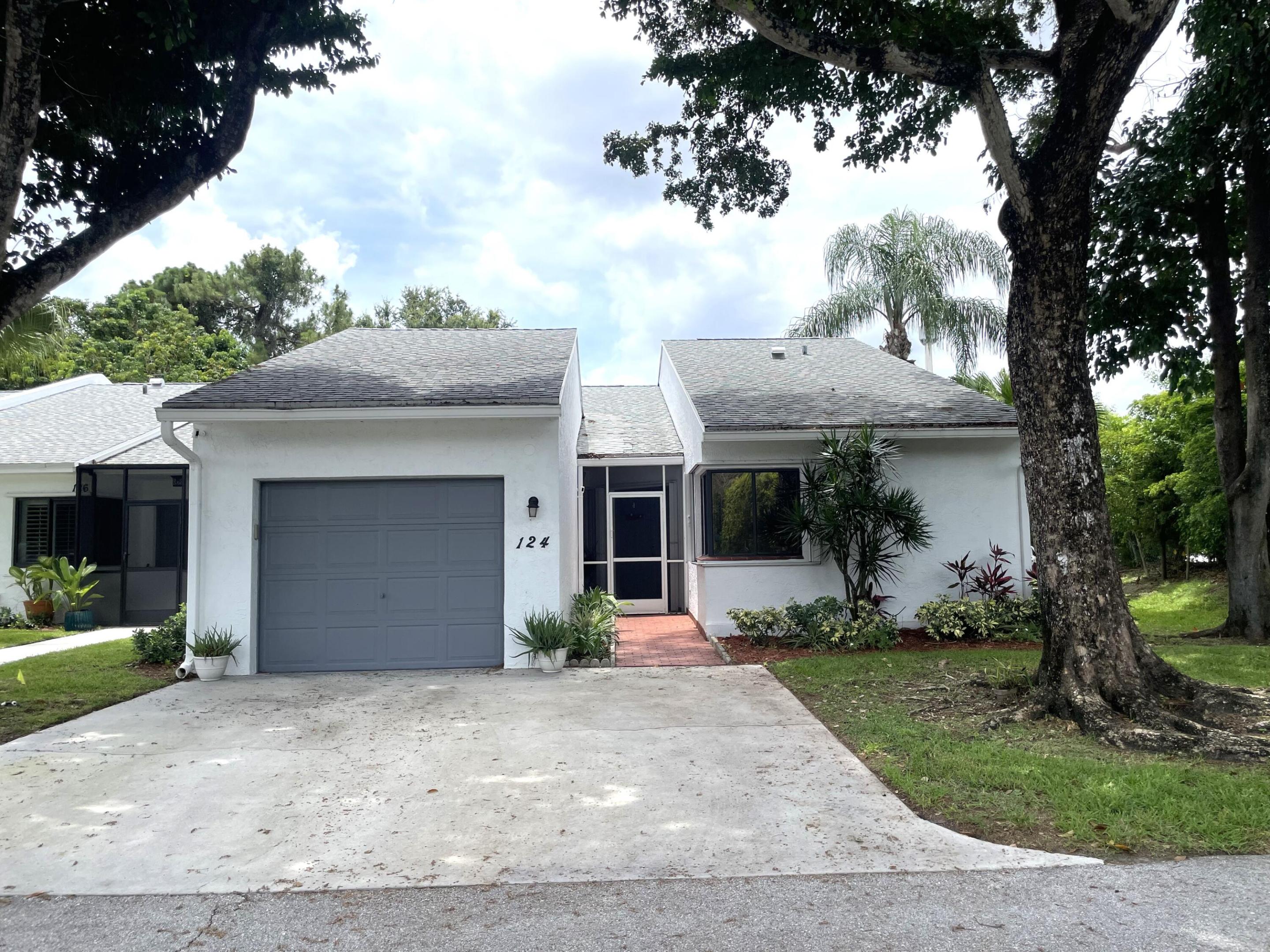 PICKING UP GOOD VIBES IN THIS WELL KEPT PET FRIENDLY  COMMUNITY OF LANTERN WALK. THIS SPACIOUS FLOOR PLAN HAS BEEN FRESHLY PAINTED, OFFERS  BRAND NEW KNOCKDOWN CEILINGS AND UPDATED KITCHEN AND BATHS. AN EAT-IN KITCHEN, LARGE LIVING/DINING AREA WITH SOARING CATHEDRALS, SPLIT BEDROOM PLAN AND INDOOR LAUNDRY.  THE LARGE PRIMARY SUITE OFFERS 2 WALK-IN CLOSETS AND AN EN SUITE CONSISTING OF A TUB/SHOWER COMBO. A COVERED AND SCREENED PATIO WITH STORAGE CLOSET, AND ACCORDIAN HURRICANE SHUTTERS MAKE IT COMPLETE. UPGRADES INCLUDE: NEW 42" BIRCH CABINETS, BEAUTIFUL QUARTZ COUNTER TOPS & WHITE SUBWAY TILED BACKSPASH. BOTH BATHROOMS HAVE NEW VANITIES WITH QUARTZ COUNTERTOPS, AND THE PRIMARY A FULL WALL MIRROR.  FRESHLY PAINTED, NEW KNOCKDOWN CEILINGS AND NEW SCREENS ON FRONT AND REAR PATIO.