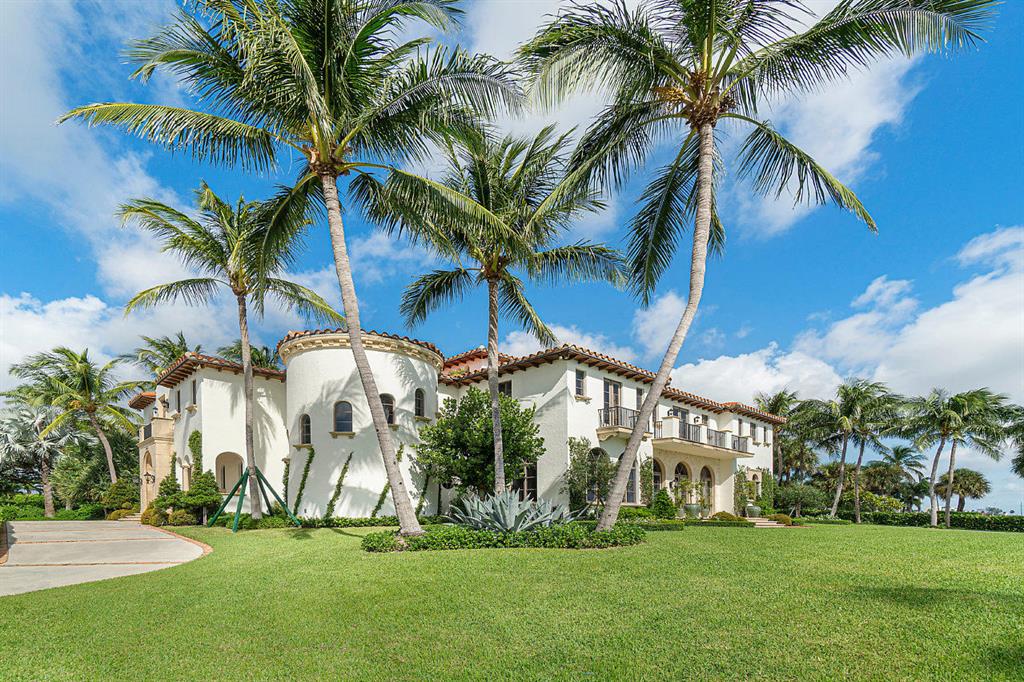 Welcome to 6215 S Flagler Drive, West Palm Beach, 33405, an expansive, one of a kind, estate in the highly desirable south end or 'SoSo' waterfront neighborhood. The epitome of South Flagler Drive living, this home will steal your heart with its awe-inspiring details and meticulous craftsmanship. Custom designed by Smith & Moore Architects, this luxurious residence offers one of the widest water-frontage sites available in the south end with a dock, two boat lifts and enough depth to moor a 100 foot yacht, impact glass throughout, and resting on over nine feet elevation. No expense was spared in the drastic 2019 overhaul, which resulted in a comprehensive redesign of the entire home that far exceeds the typical remodel updates that you would generally expect. Updates include all new custom cabinetry, all new high end, Dacor appliances, marble flooring, Chesney mantles, Smart home features, Sonos Sound System, Tesla wall charger, Thermaseal energy efficient foam insulation, and Parisian wallpaper just to name a few.  Situated ideally just minutes from Palm Beach, beaches, the Palm Beach International Airport, The Norton Museum, The Flagler Museum, The Breaker's Hotel, Worth Avenue, and much more. 6215 S Flagler Drive, West Palm Beach, FL 33405 a simply magnificent, must see, home!