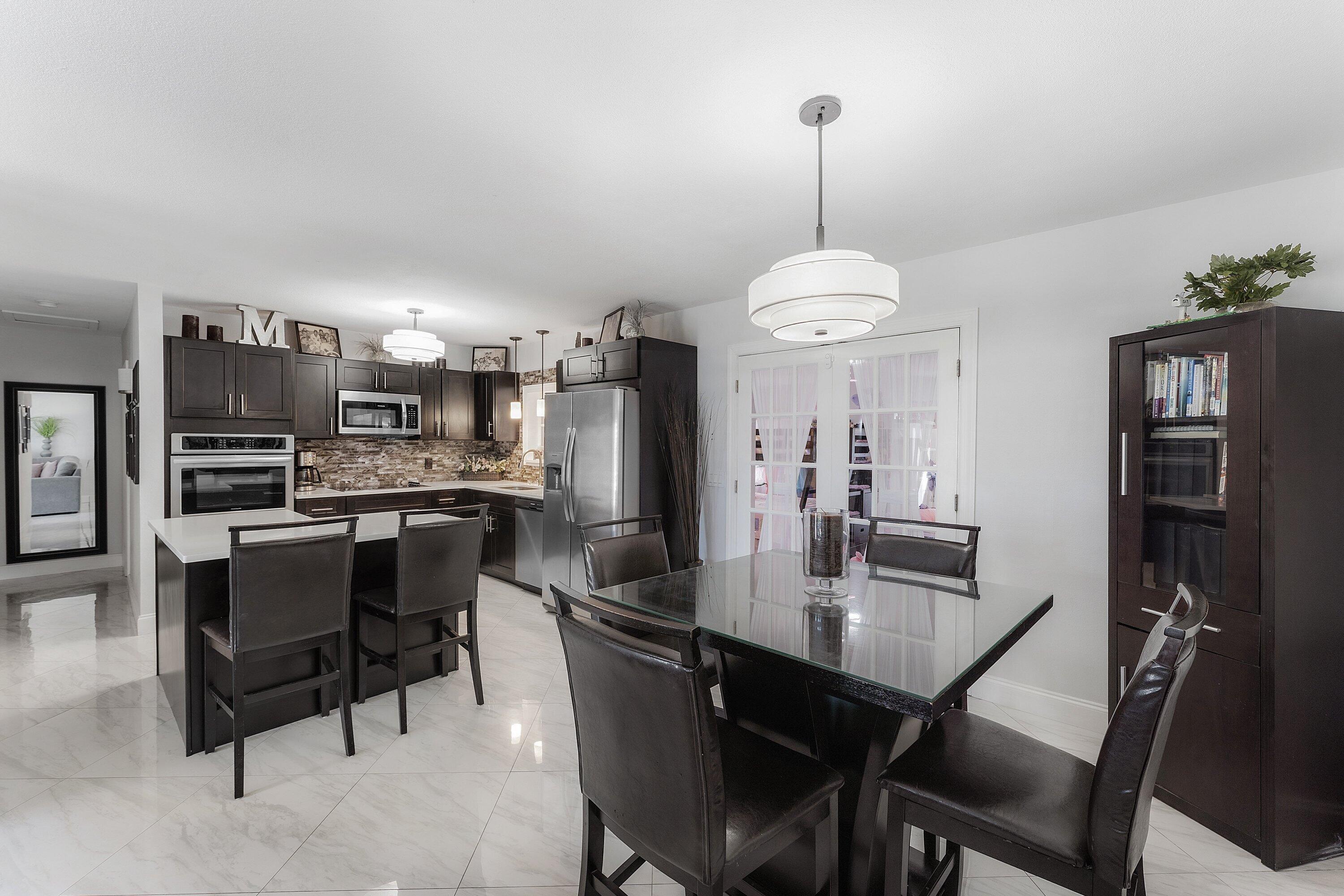 Ideally located EAST OF I-95 with NO HOA in the coveted Tropic Palms neighborhood! This beautifully renovated, impeccably maintained home offers ultimate flexibility just minutes from Delray's beaches and Atlantic Avenue. The main residence features 2 bedroom/ 1 bathroom plus a large versatile flex space ideal for an office or 3rd bedroom. An attached, fully private 1-bed, 1-bath suite with its own private entrance and outdoor sitting area offers the perfect setup for Next-Gen living or generating lucrative rental income. Unwind in a private, relaxing, maintenance-free backyard featuring premium artificial turf, surrounded by full hurricane impact protection. Bring your toys, your pets, and enjoy unrestricted freedom in East Delray!