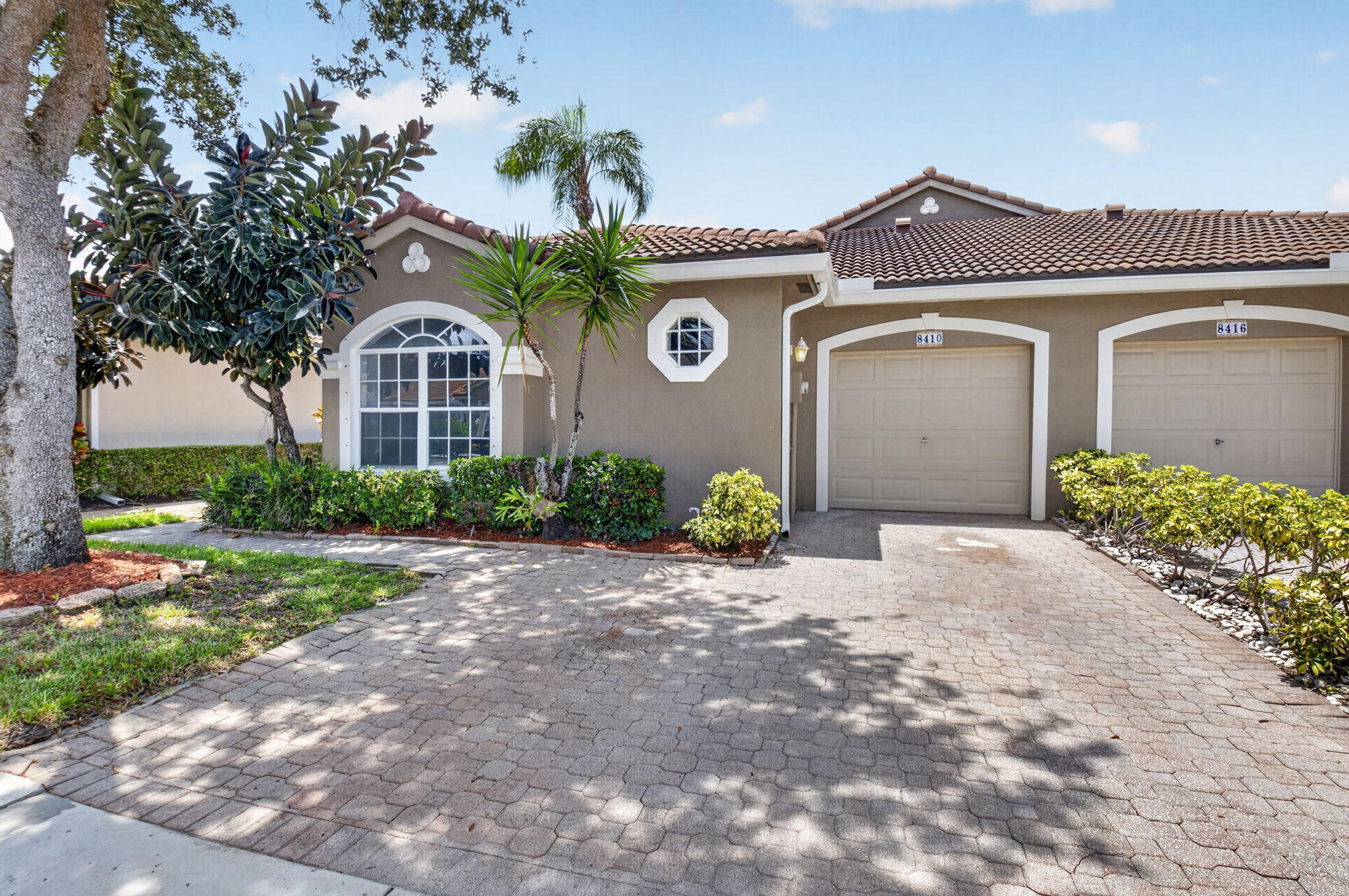 Move right into this beautifully remodeled 3-bedroom, 2.5-bath townhome with a 1-car garage in the  gated community of Mizner Pointe. This turnkey home has been tastefully updated with vinyl plank flooring throughout, fresh interior paint, beautifully remodeled bathrooms, and a brand-new kitchen featuring all new stainless steel appliances. The open and inviting floor plan offers spacious living and dining areas, while the oversized primary suite includes a walk-in closets. Enjoy a screened patio perfect for relaxing or entertaining. Mizner Pointe offers exceptional resort-style amenities including a clubhouse, fitness center, swimming pool, tennis courts, playground, and 24-hour manned gate.