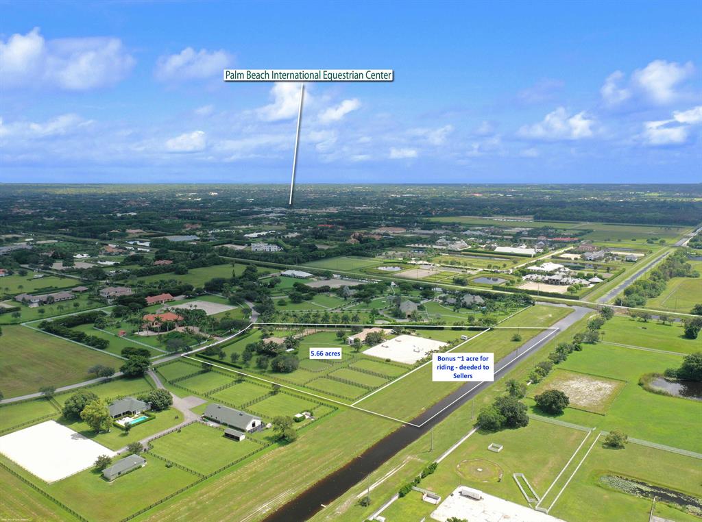 Rare opportunity to own this 5.66 acre equestrian estate in Palm Beach Point, with ability to ride on an additional ~1 acre along the canal. Property has a 4 bedroom/3 bathroom pool home with 2 master suites and a 12 stall center-aisle barn, both with generators. The pool home has a new pool heater and chiller, 3-car finished garage, separate office, and new Viking appliances in the kitchen. The property has a great site plan, with the home towards the front and the equestrian features all located in the back, with ~140' x 200' GGT footing arena. The barn has AC'd feed room, tack room and a one bedroom staff apartment, plus 3 wash/grooming stalls, laundry room, half bath and separate shaded viewing area. Additional parking behind the barn for trucks and trailers. DISCLAIMER: All information provided to you regarding this Property by Realtor and their associates has been obtained from third parties such as the Multiple Listing Service, public records and other sources. All Buyers should independently verify all information provided regarding this Property. The Sellers, Realtor and Broker make no representation as to the accuracy of this information. All Buyers should perform their own independent due diligence regarding this Property before executing a Contract for Sale and Purchase for this Property.