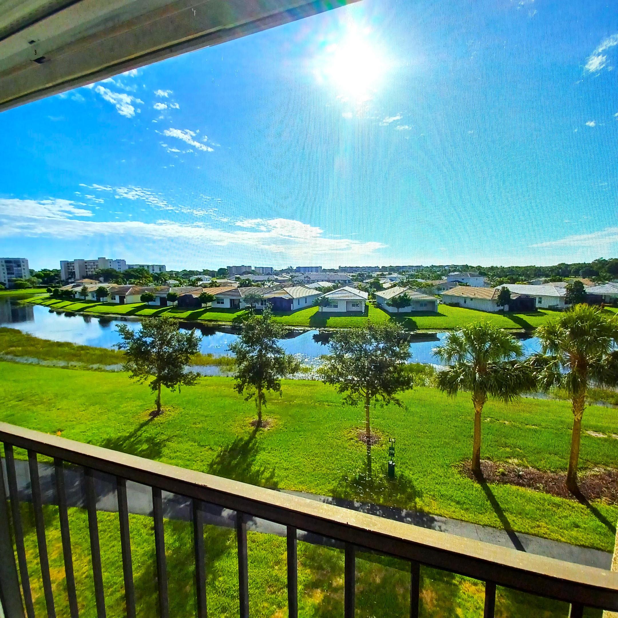 *Updated* Highly sought after Building 40, Lancaster Model, 2/2 Lake View.  Light and bright, w/East exposure from enclosed Balcony.  Kitchen wall opened and kitchen updated.  All Appliances Updated in 2025, GE Stainless Steel.   Large Master Bedroom w/ large sitting area w/two walk-in closets.    Master and Guest Bathrooms Updated, Granite, Frameless Shower Door,  New Light fixtures.    2022 CARRIER Air Conditioning w/Ultra Violet Light.   Newer high end, Mohawk waterproof Laminate Flooring throughout w/Hi Baseboard Molding.    Custom Vertical Blinds.  New tile Flooring in Balcony and all new screening.  This is a Designer Home in Immaculate condition.   The Furniture, (turn-key) or select pieces can be included in the sale.  A Must See, move-in ready property that is priced to sell!   Huntington Lakes is a Guard Gated, Active Adult community in Delray Beach.   The community is located approximate 15 minutes from the Ocean and 10 minutes from downtown Delray Beach.    The community clubhouse was recently renovated.   There is a full theater, in-door swimming pool, gym, spa, locker rooms, ball room, card rooms, poker and billiards.   The renovation is a must see.  There are no Special Assessments or Upcoming additional charges.  The Seller has paid for all the renovation costs.