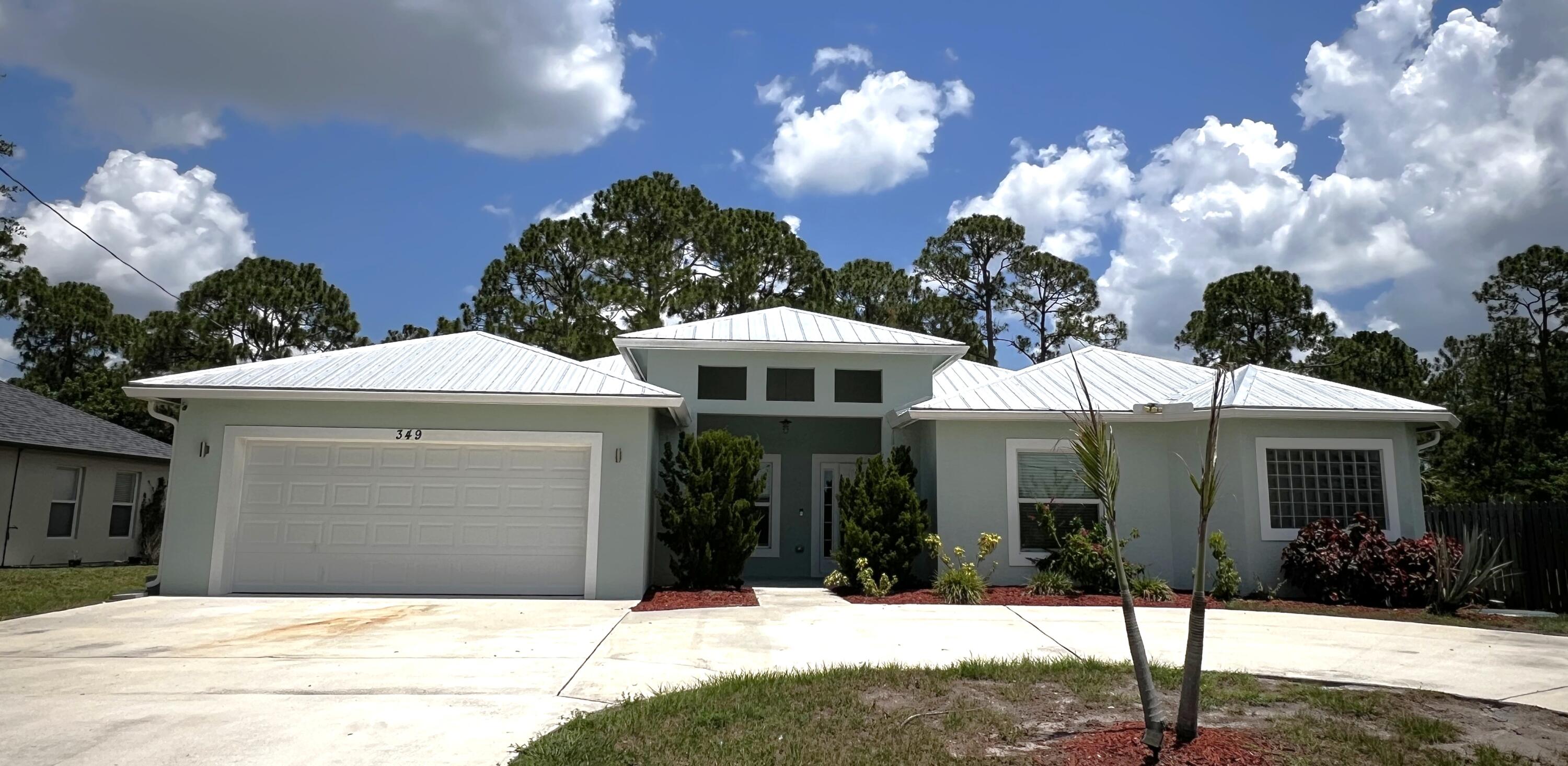 Looking for room to spread out? This beautifully designed, freshly painted 5 bedroom, 3 bath single family home offers nearly 3,000 square feet of thoughtfully designed living space with the flexibility today's renters are looking for. Featuring an additional den and a bonus flex room, you'll have endless possibilities for a home office, media room, playroom, gym, second living area, or hobby space. The open concept floor plan is centered around an oversized chef's kitchen with tons of cabinetry, expansive countertops, a large island, and plenty of room to gather while overlooking the spacious main living area. The desirable split bedroom layout provides added privacy, while the impressive primary suite serves as a true retreat with two walk-in closets and a spa-inspired ensuite featuring featuring a freestanding soaking tub, an oversized walk-in shower, and dual vanities. Enjoy the beauty and durability of tile flooring throughout the main living areas and laminate flooring in all bedrooms, creating a stylish, low maintenance living environment. Step outside to a screened lanai overlooking the partially fenced backyard, perfect for relaxing or entertaining. The circular driveway offers abundant parking for multiple vehicles, plus space for a boat or RV, in addition to the attached garage. No HOA! Immediate move-in available. Professional landscaping is included in the rent, so lawn care is one less thing to think about. Pets are welcome with owner approval and a non-refundable pet deposit.  This exceptional home combines generous living space, modern finishes, and everyday convenience in a versatile layout designed to fit a variety of lifestyles. Don't miss the opportunity to make this beautiful home yours!