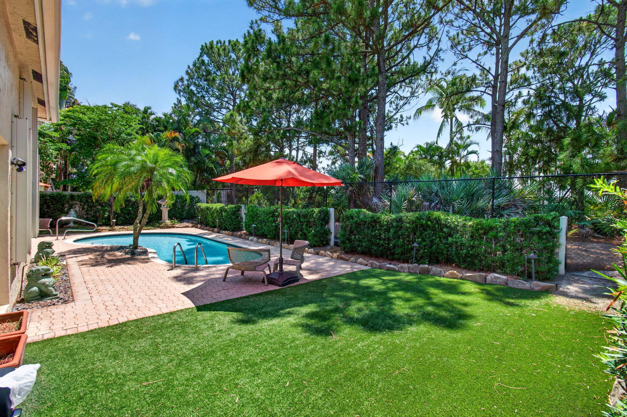 Welcome to 68 Lake Eden Drive — a beautifully maintained 4-bedroom, 3-bath pool home tucked inside a quiet gated community in the heart of Boynton Beach. With 12 foot ceilings, an open floor plan, and stylish upgrades throughout, this move-in ready home offers the perfect mix of comfort, privacy, and South Florida living.  Inside, you'll find luxury vinyl flooring, a spacious kitchen with quartz countertops, and bright living spaces designed for both everyday living and entertaining. The primary suite is generously sized and features separate dual closets along with a spacious bathroom retreat.  The home has been thoughtfully updated with a 12/2021 roof, 2024 A/C system, 2020 hot water heater, front impact window, impact back door, and accordion shutters throughout for added peace of mind and storm protection.  Step outside to your own private backyard oasis complete with a pool, automatic pool lighting, mosquito spray system, and tranquil preserve views with no rear neighbors — creating a peaceful setting to relax or entertain year-round.  Location is everything, and this home delivers. Just minutes from downtown Delray Beach and Atlantic Avenue, you'll be close to some of South Florida's best dining, shopping, nightlife, beaches, and entertainment. Golf lovers will also appreciate being surrounded by several of the area's most prestigious country clubs and championship golf courses.  A rare opportunity to enjoy space, privacy, and convenience all in one exceptional location.