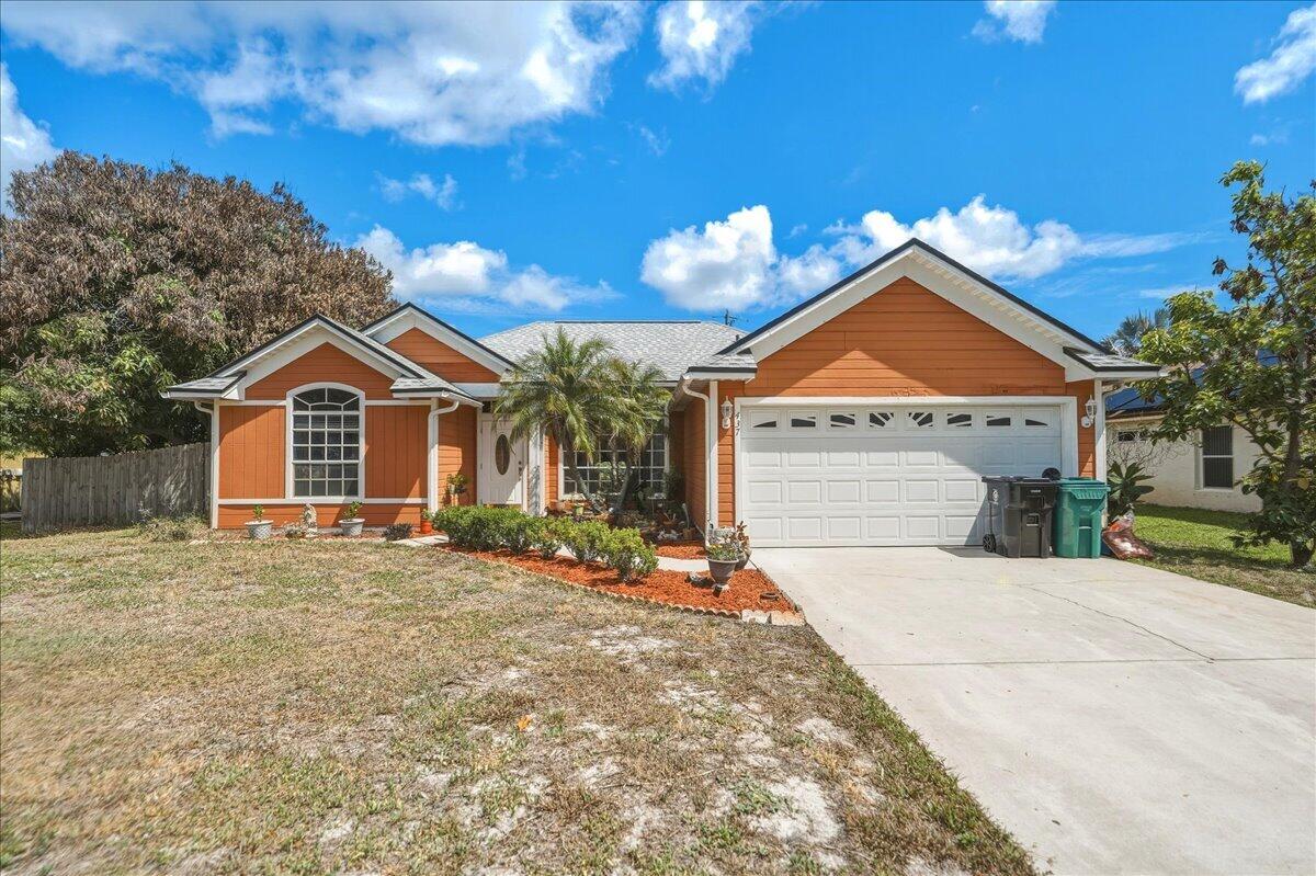 Come see this beautiful 3 BED 2 BATH 2 car garage POOL home in Port St Lucie! Roof, water heater, and AC all replaced in 2023.  Covered and screened patio, with serving window. Enjoy Florida living year-round with a recently resurfaced pool! Inside, vaulted ceilings throughout create a spacious feel. Updated kitchen features quartz countertops, stainless steel appliances, large pantry, and hexagon tile backsplash. The primary bedroom offers a walk-in closet, tiled shower, and soaking tub. Tile and vinyl flooring throughout- no carpet! New washer and dryer. New guest bathroom vanity. Gutters around the home. Fully fenced lot with gates on both sides- plus mature mango, avocado, and coconut trees. Convenient access to I95, and the Turnpike. Schedule your private tour today!