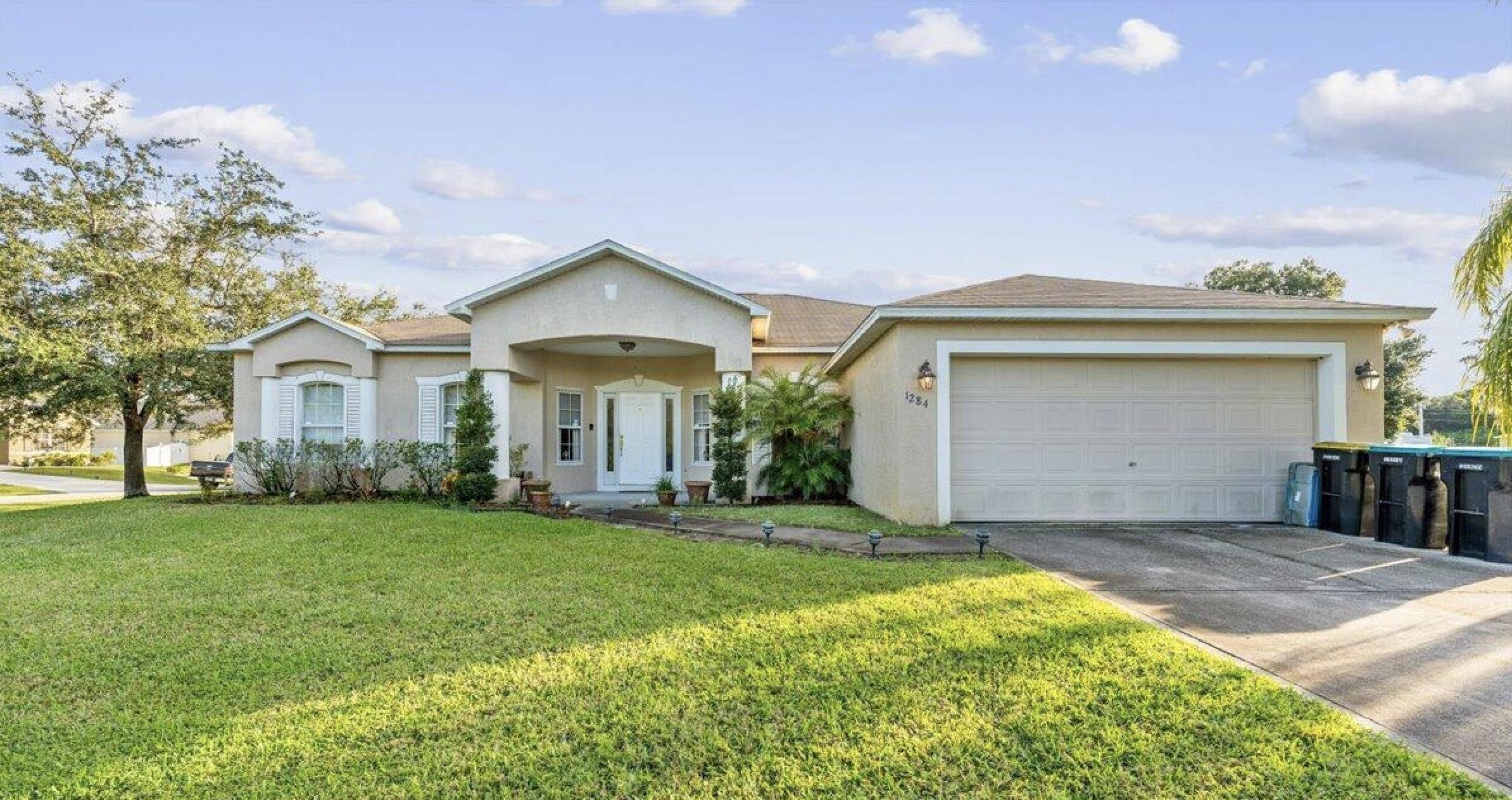 Welcome to this well-maintained 4-bedroom, 2-bath home in Palm Bay—no HOA! Built in 2005 and offering 2,252 sq. ft., this home sits on a generous .38-acre lot with a functional split floor plan and a 2-car garage. Major updates include a new roof and A/C (just 2 years old), giving peace of mind. Step outside to your screened-in lanai featuring a relaxing spa/hot tub, perfect for unwinding. A standout feature of the property is the impressive metal barn/workshop with two overhead doors and RV electrical hookup, offering exceptional space for storage, hobbies, equipment, recreational vehicles, or additional workspace. An additional storage shed provides even more room for tools and toys.