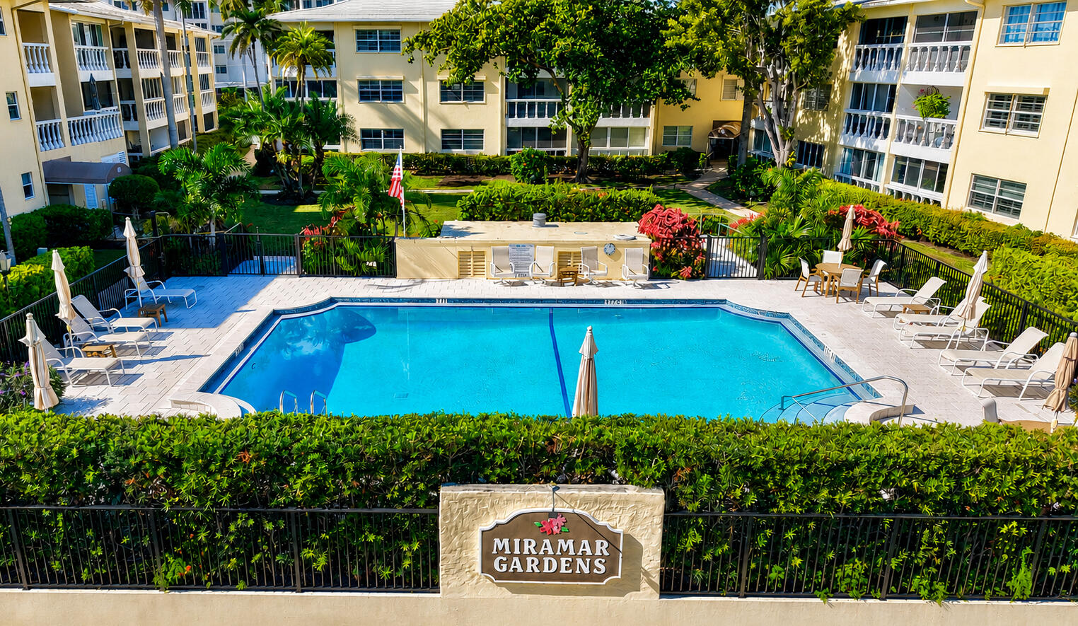 Unbeatable Location!  2 blocks from beach... 1/2 block to Atlantic Avenue. This perfectly positioned unit directly overlooks the pool and lush courtyard. It features an open design concept, a remodeled kitchen with  white quartz countertops. New bathrooms, outside hurricane doors/interior doors, CUSTOM WOODWORKING, designer wallpaper and PLANTATION SHUTTERS THROUGHOUT.  Miramar Gardens is a financially sound, meticulously maintained boutique community of just 48 residences.  Amenities include an elevator, on-site storage, assigned resident and guest parking, BBQ area, designated pool restrooms, and on-site maintenance.