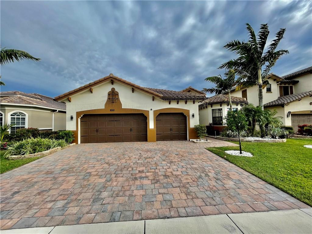 Gorgeous Lakefront Cumberland Split Floor Plan One-Story Model W/4 Beds, 3 Baths Home, 3 Car Garage! Upgrades Include New Wood-Looking Tile Floors In All Beds, All New Light Fixtures, Built-In Wall Rock Features w/Fireplace, Oversized Fenced-In Lot Perfect For A Spacious Pool & Covered Pavered Patio Area Great For Entertaining! Wide Long & Expansive Long Lake Views. Enjoy Sunsets & Amazing Afternoon Breezes. Double-Door Entry Leads To Formal Living Room, Huge Dining Room Ideal For Holiday Meals, Master Suite w/Sitting Area, Walk-In Closets. Impact Windows & Doors Throughout, Tankless Water Heater, Large Kitchen w/GE Stainless Steel Appliances, Granite Counters, Double Oven, GE Stainless Steel Appliances. HOA Includes 2 Resort-Style Clubhouses, Lawn Care, 2 Guard Gates, & A-Rated Schools