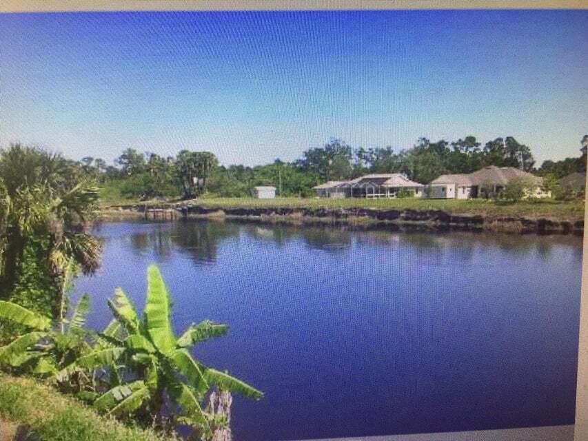 BEAUTIFUL LOT ON C-24 CANAL WITH
FRESH WATER FISHING, JET SKIES, BOATING.   BUILD YOUR DREAM HOME !