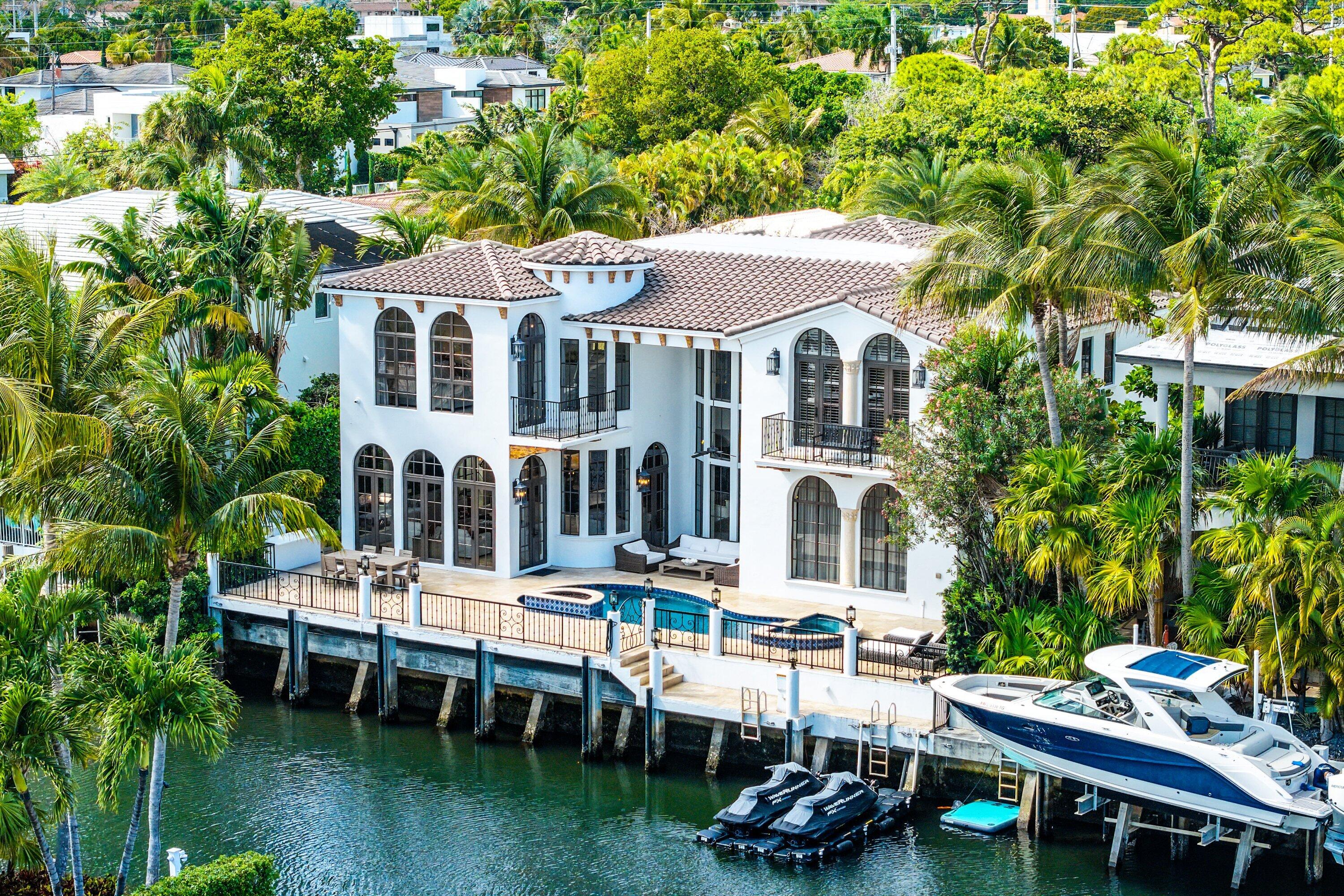 Exquisite "Montecito inspired" Deepwater Estate in prestigious Golden Harbour, East Boca Raton. This 5,200+ SF Spanish Colonial by Affiniti Architects blends timeless elegance with effortless modern living. Rich in character, the home showcases a dramatic sweeping staircase, hand-painted artistry, marble & terra cotta mosaics by Italian artisans, custom cabinetry, wood-beamed ceilings & warm, refined finishes throughout. Thoughtfully updated with a NEW 2025 roof, full-house generator, whole-home filtration, water softener & Kangen drinking water system. Set on a prime deepwater lot with no fixed bridges, enjoy direct ocean access, a private dock & a resort-style pool/patio designed for u entertaining, just moments to the Boca inlet. This is truly one of the most Stunning homes to be seen!